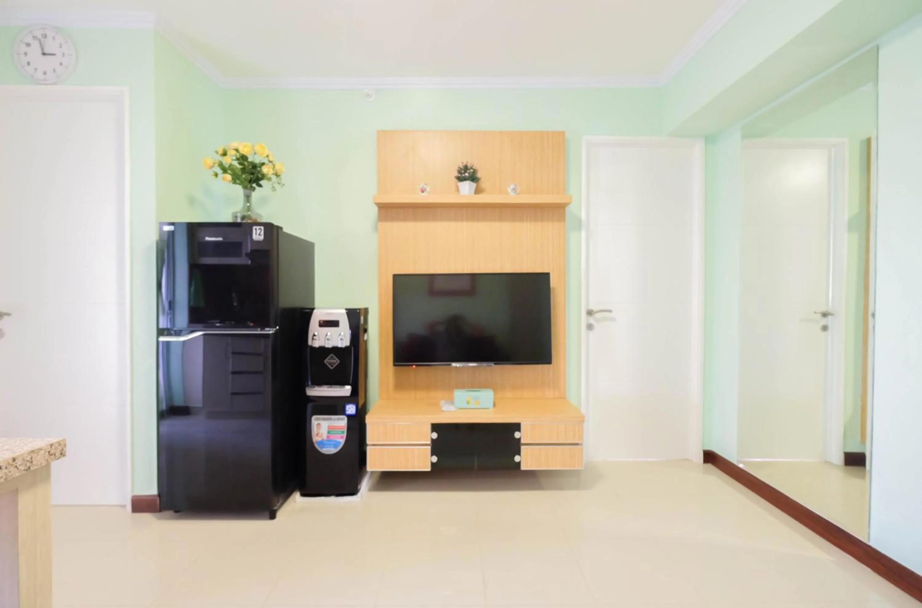 TV and multimedia in Cozy 2BR Bassura City Apartment By Travelio