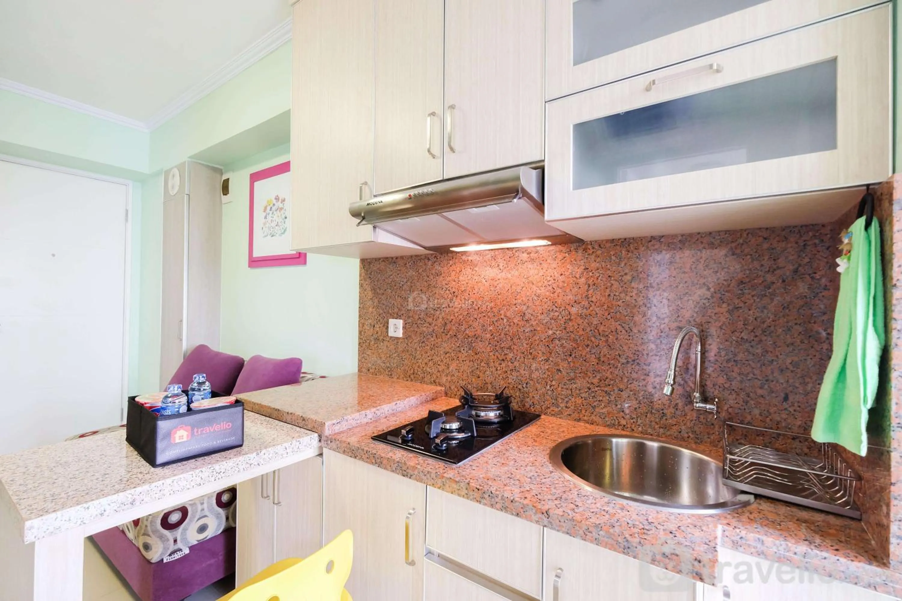Kitchen or kitchenette in Cozy 2BR Bassura City Apartment By Travelio