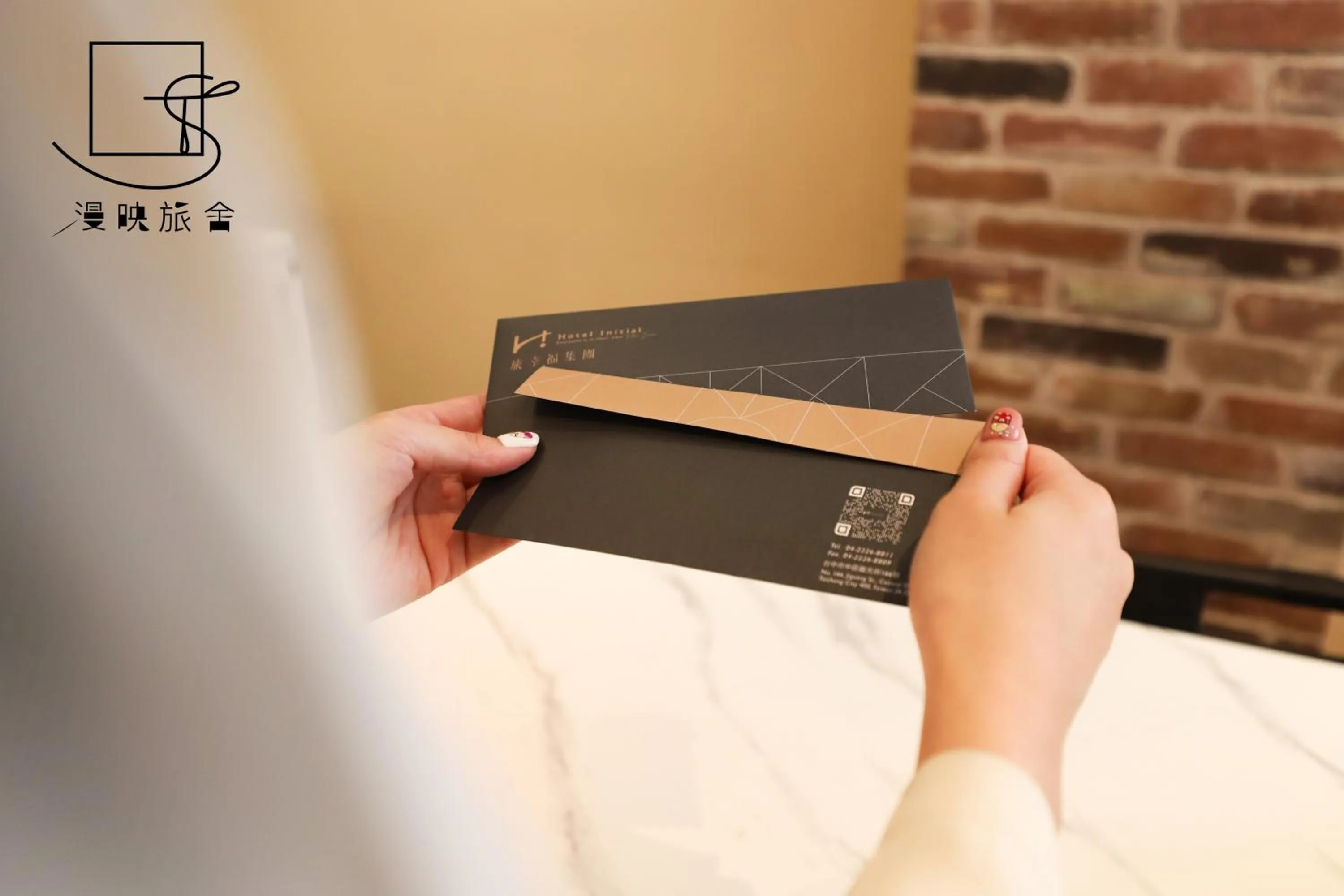 Property logo or sign in Slow Town Hotel-Reel