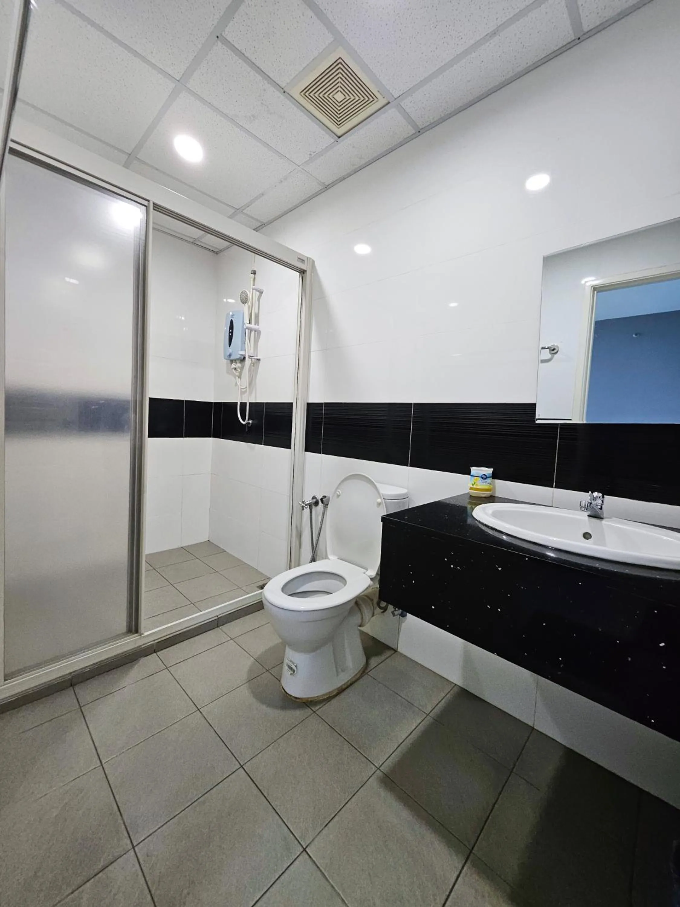 Toilet in Mansion One by Sky Hive