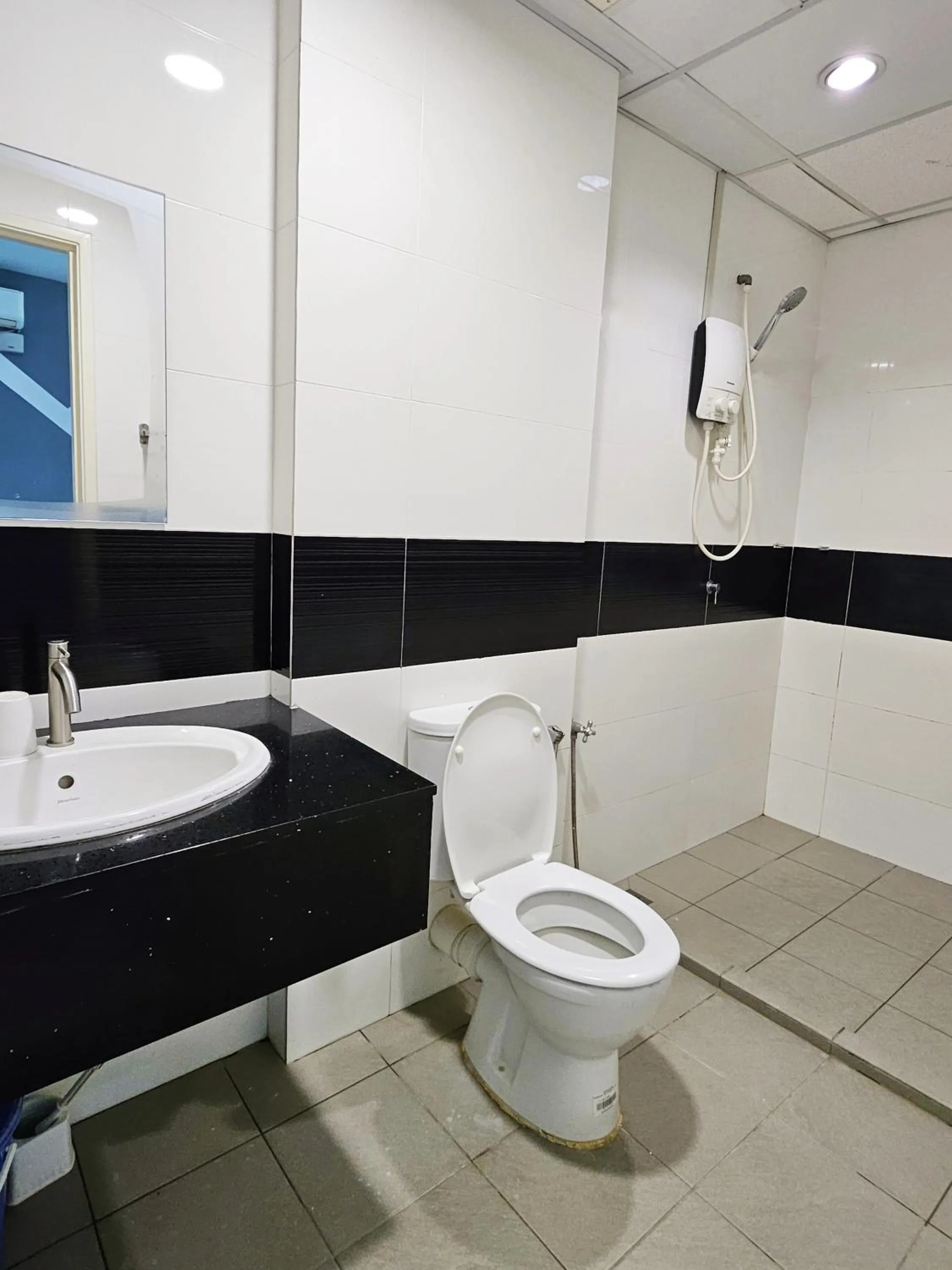 Toilet in Mansion One by Sky Hive