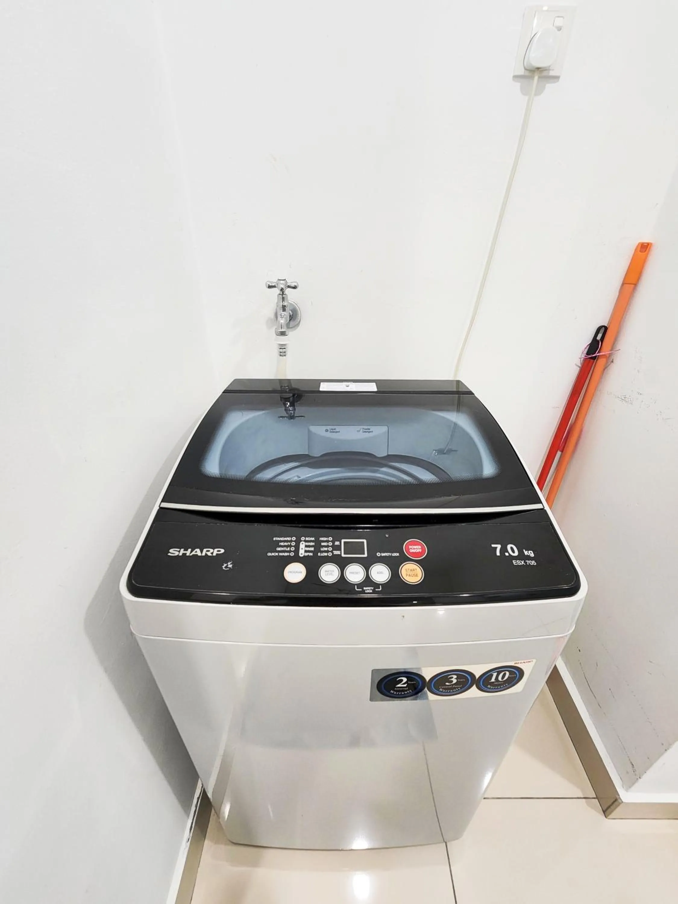 washing machine in Mansion One by Sky Hive