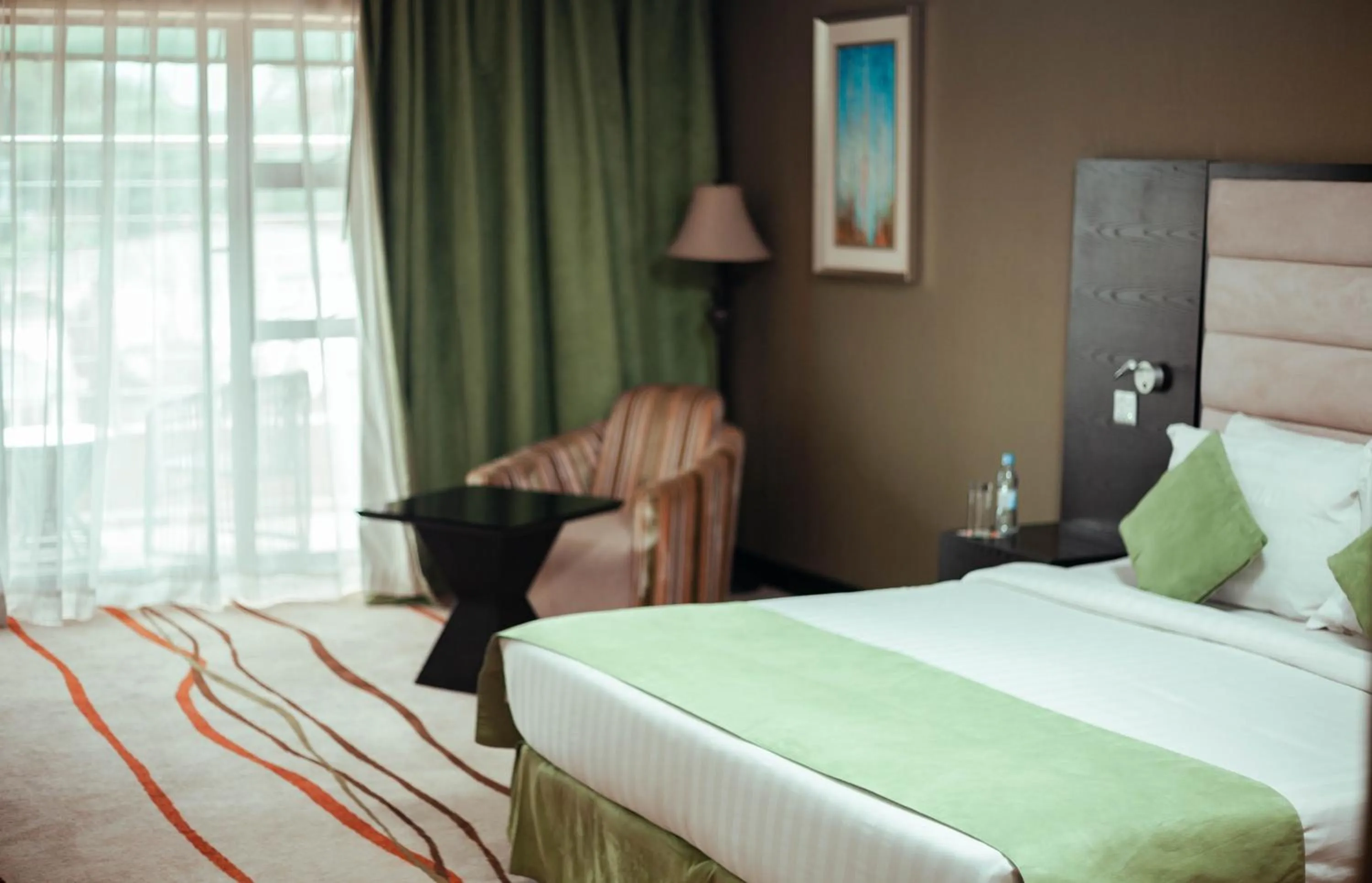 Seating area, Bed in Crossroads Hotel Blantyre