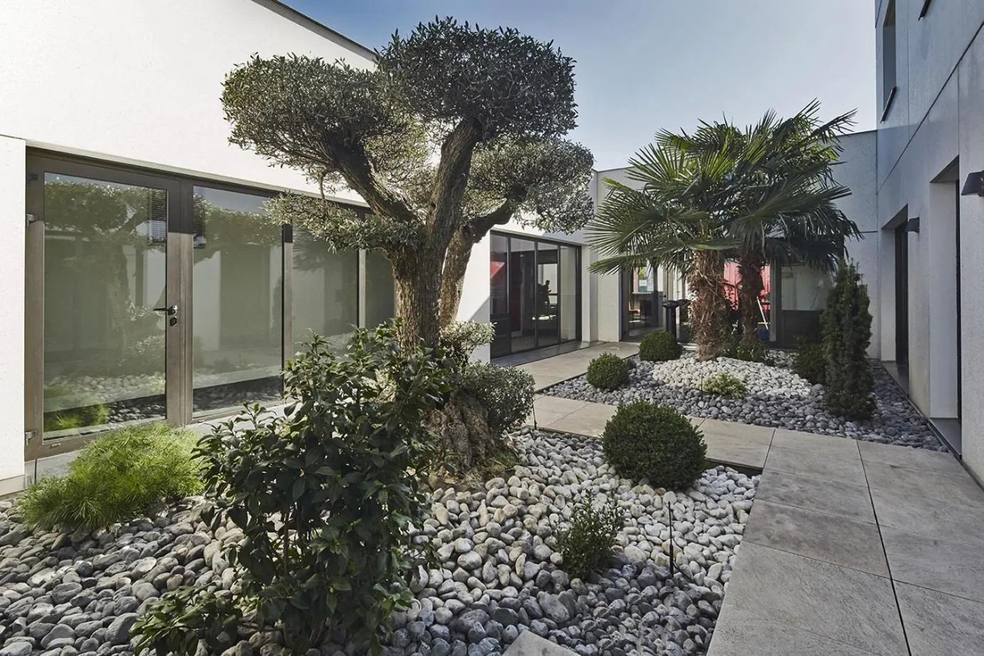 Garden in Kyriad Prestige Lyon Est - Saint Priest Eurexpo Hotel and SPA