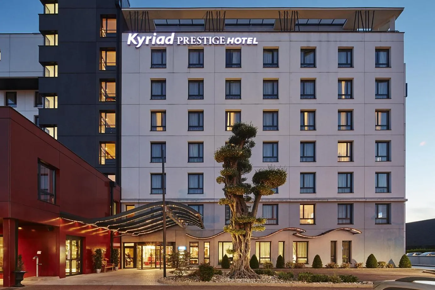 Property building in Kyriad Prestige Lyon Est - Saint Priest Eurexpo Hotel and SPA