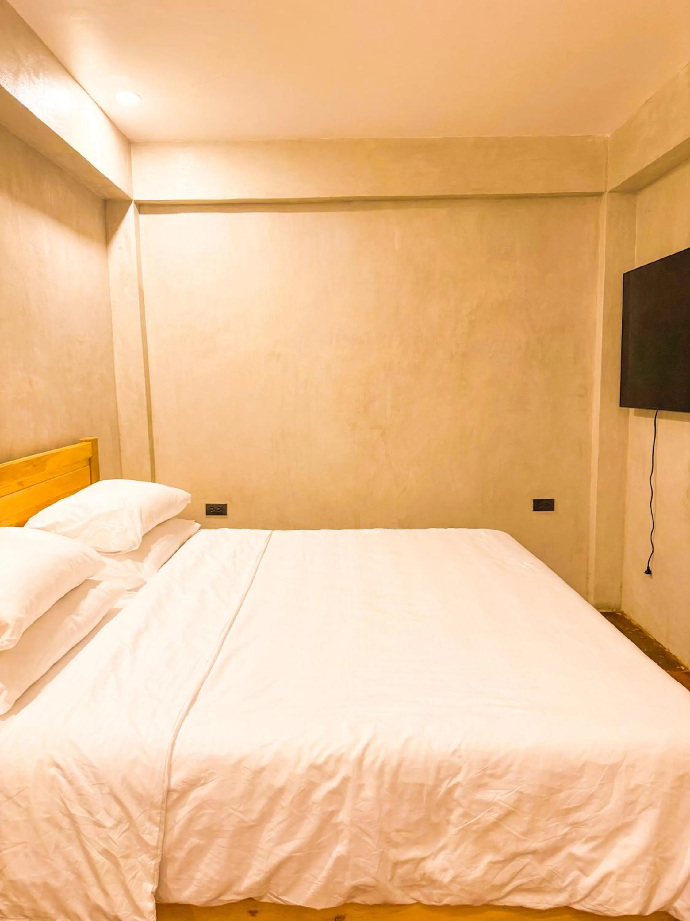 Bed in Charisma Beach Resort