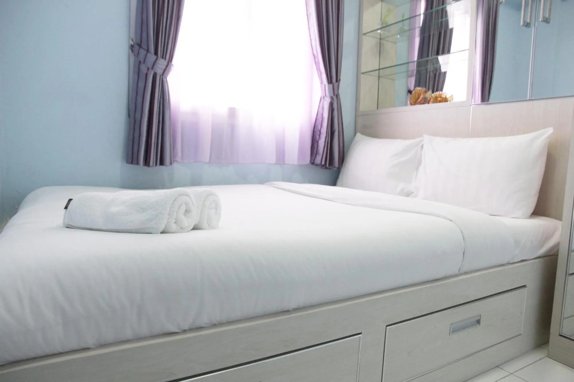 Bed in Comfortable 2BR Mutiara Bekasi Apartment By Travelio