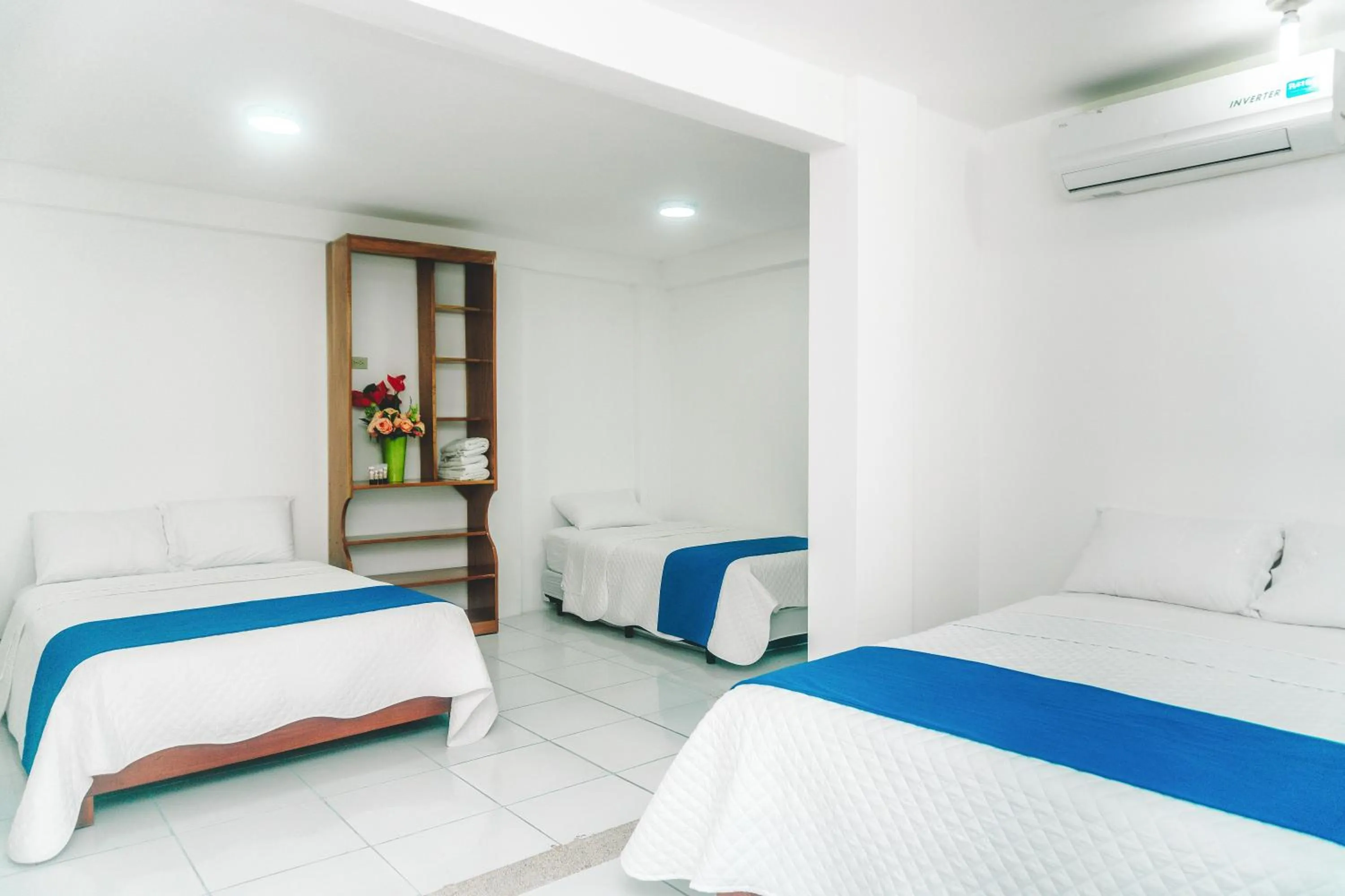 Bed in Galápagos Isabela Hotel Loja