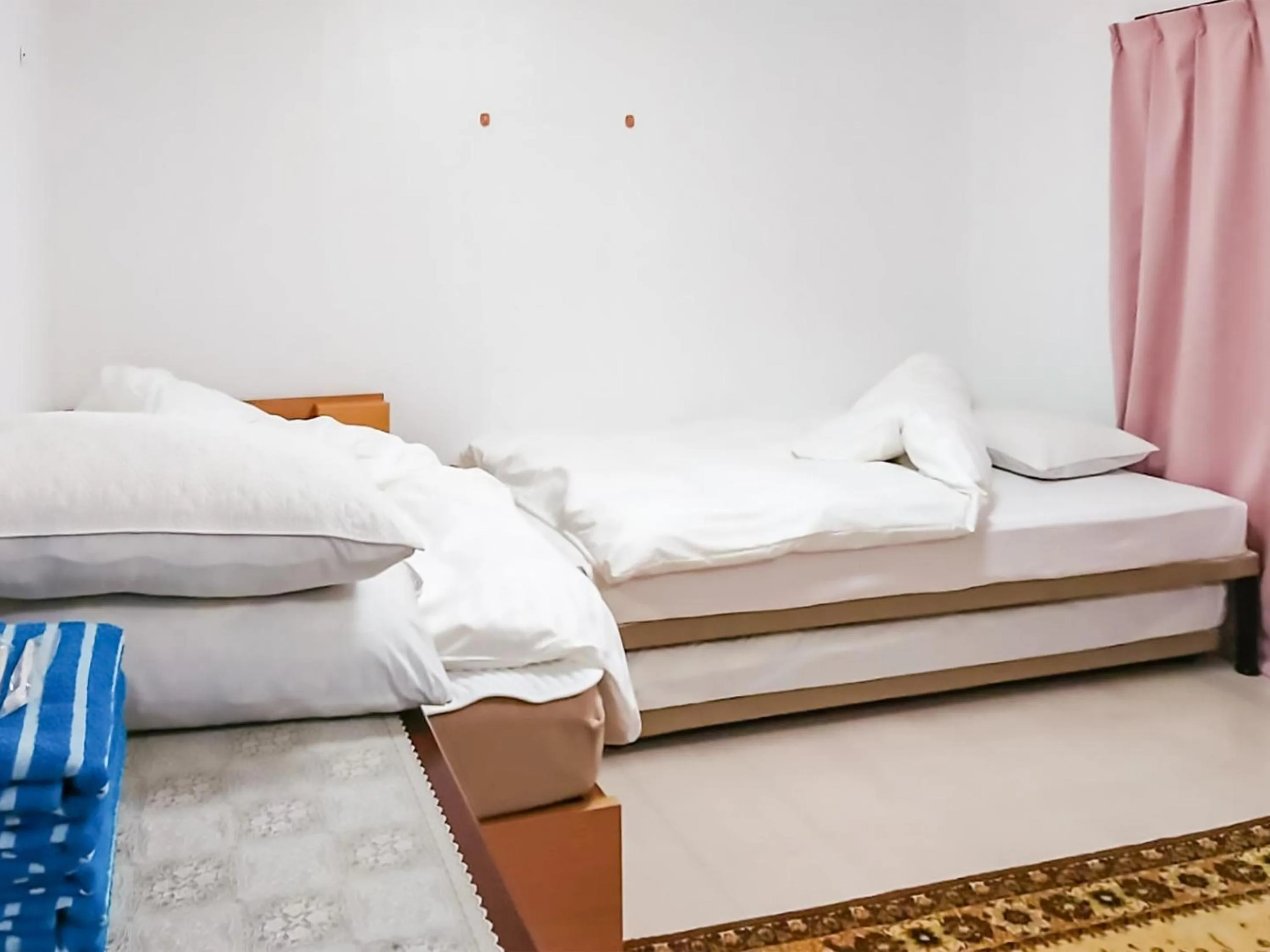 Bed in Oyama Guesthouse Kyoto