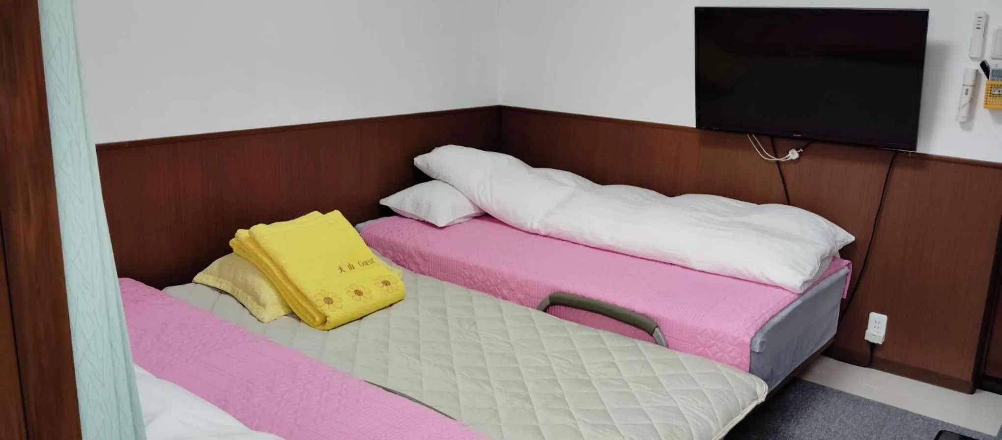 Bed in Oyama Guesthouse Kyoto