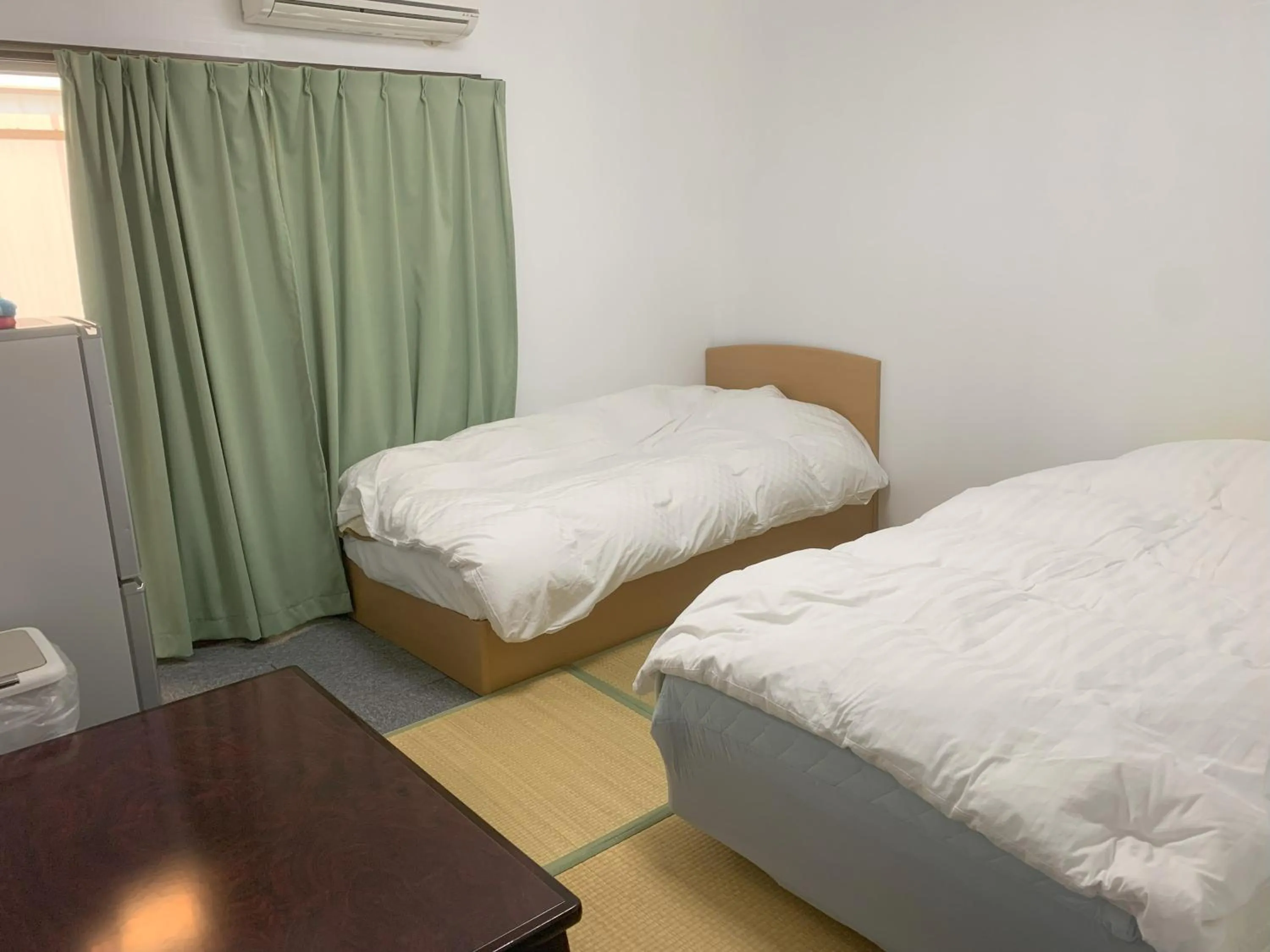 Bed in Oyama Guesthouse Kyoto