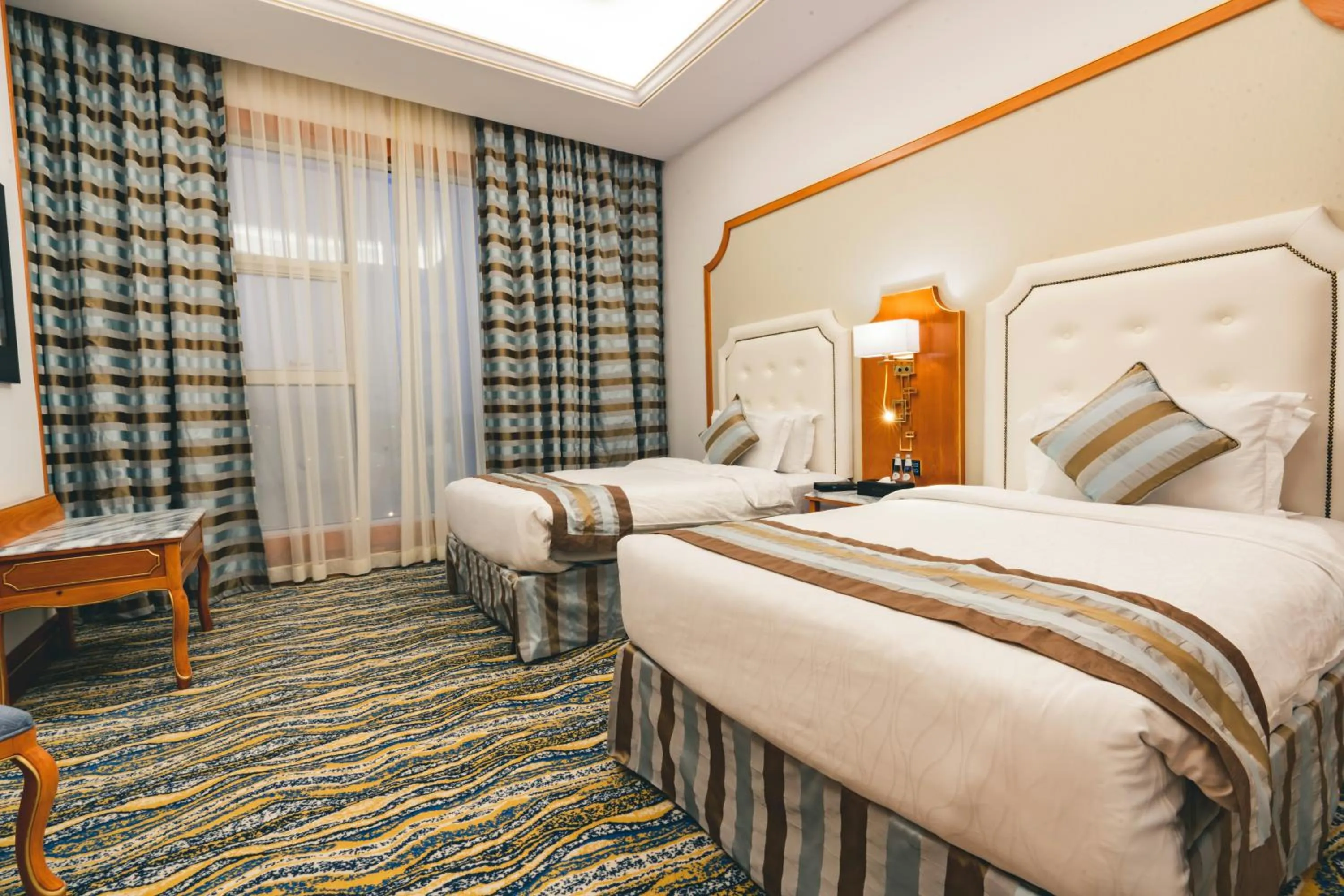 Bed in Iridium Hotel