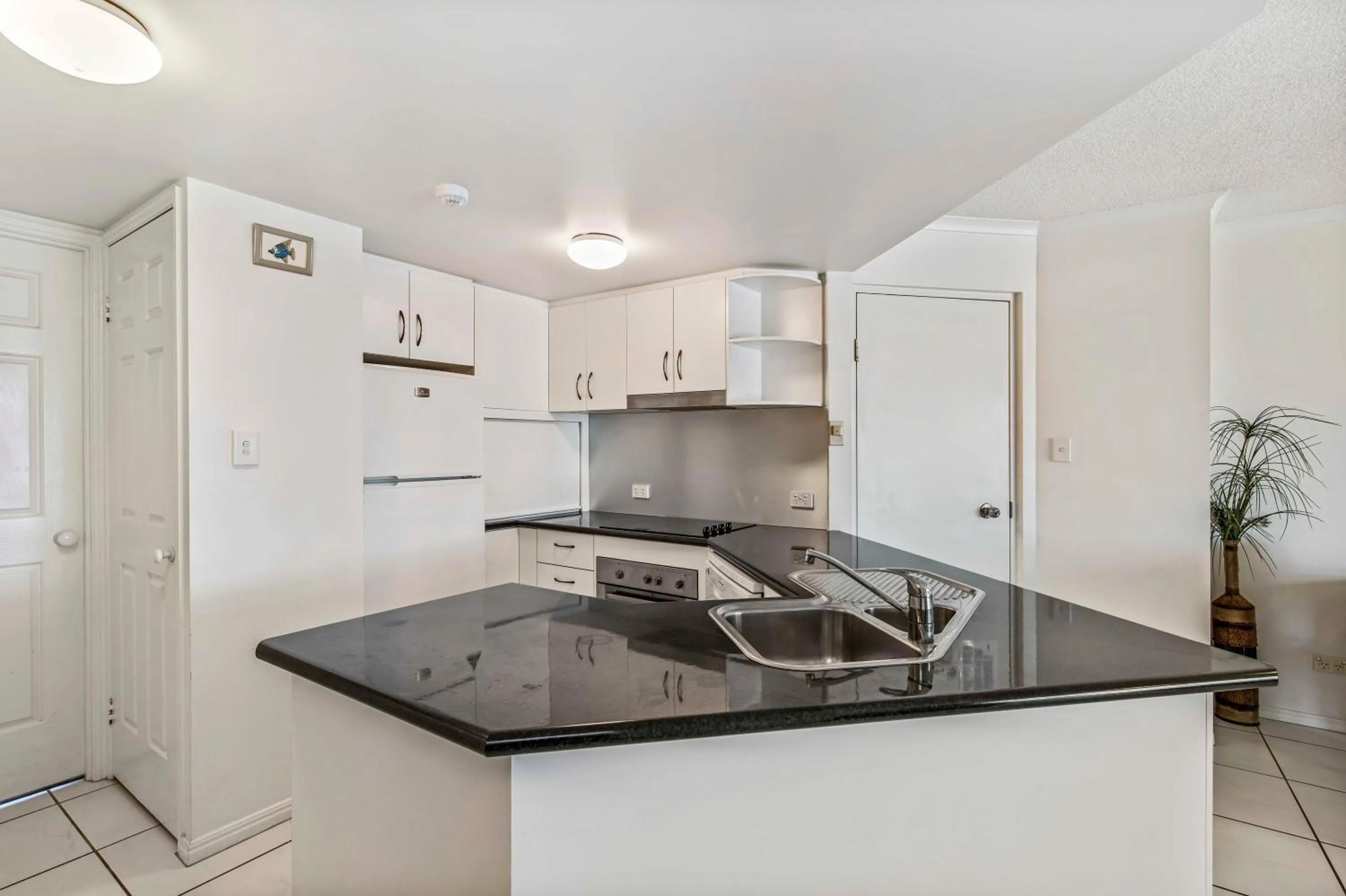 Kitchen or kitchenette in Reflections Holiday Apartments