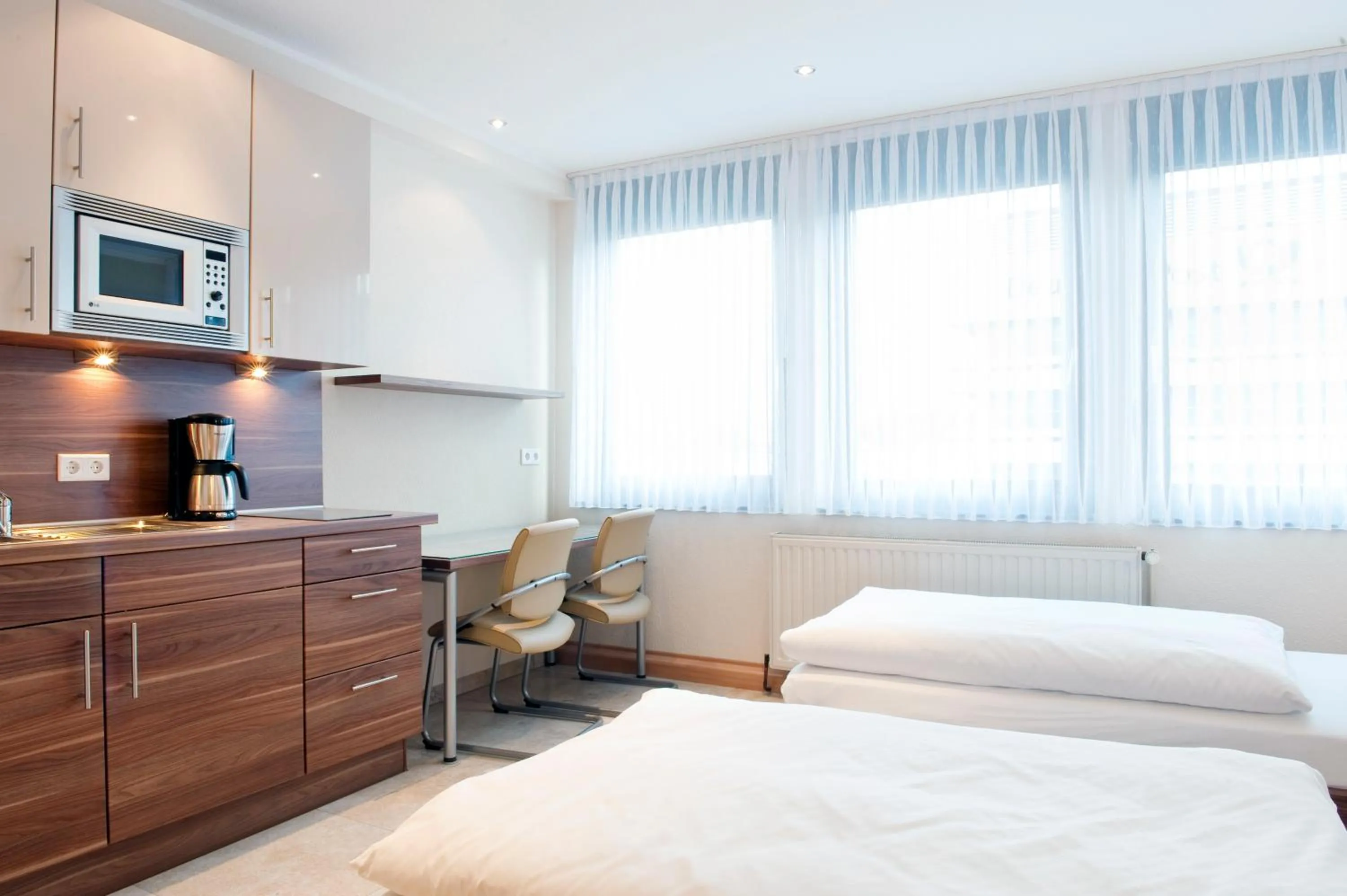 Kitchen or kitchenette, Bed in Appartements am Kleeblatt