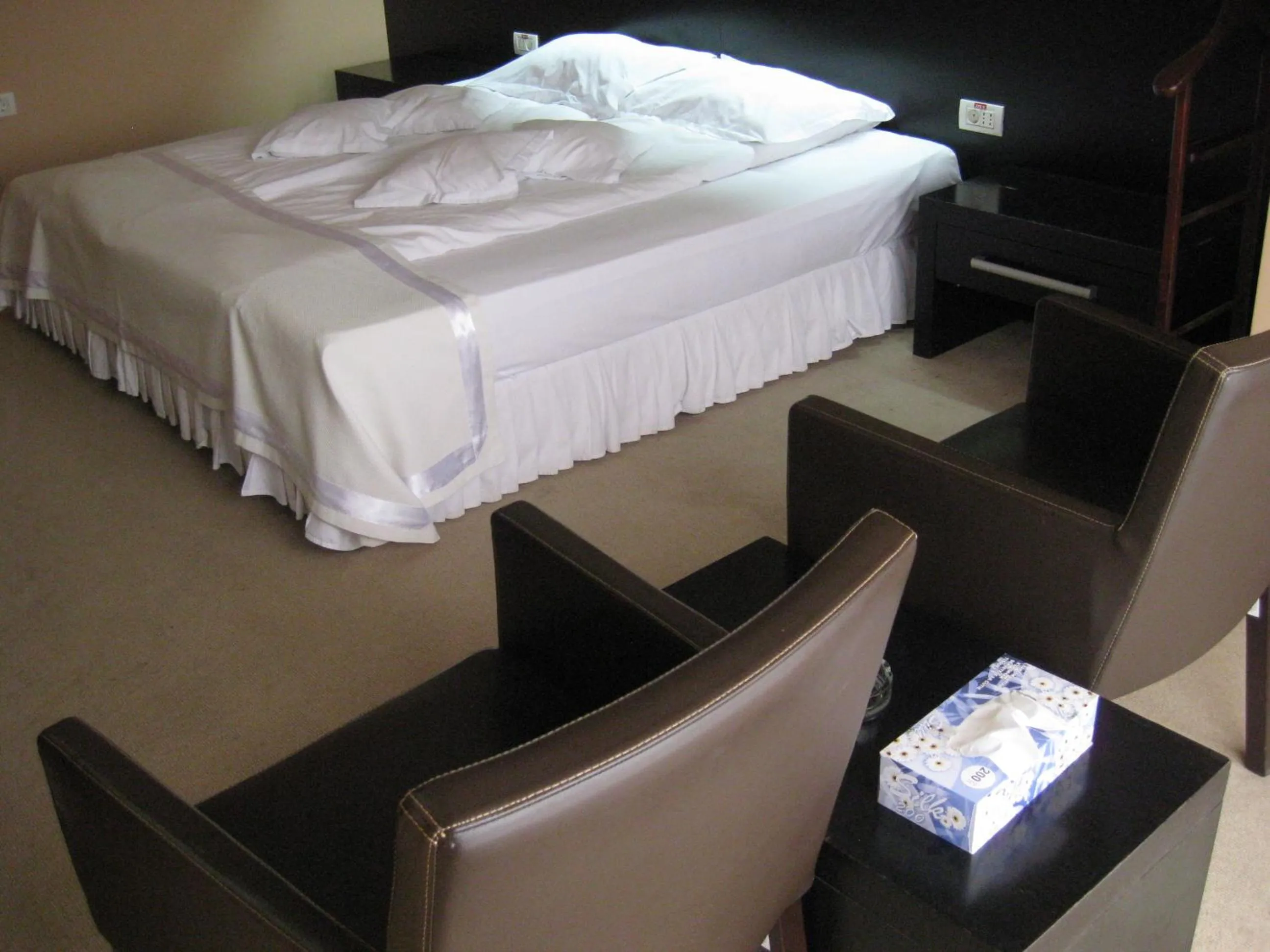 Seating area, Bed in Hotel Delpack