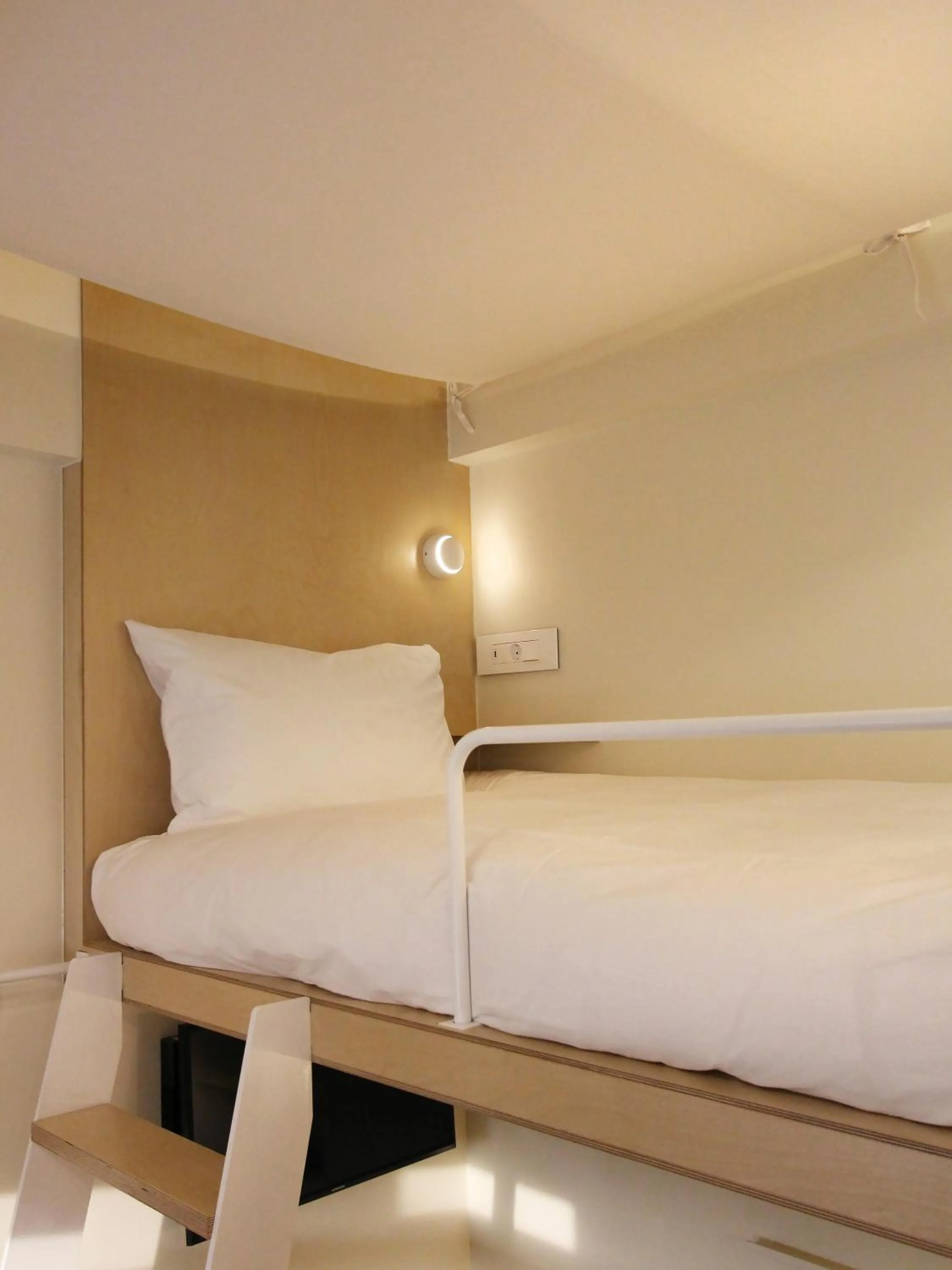 Bed in Tong Tong Petit Hotel