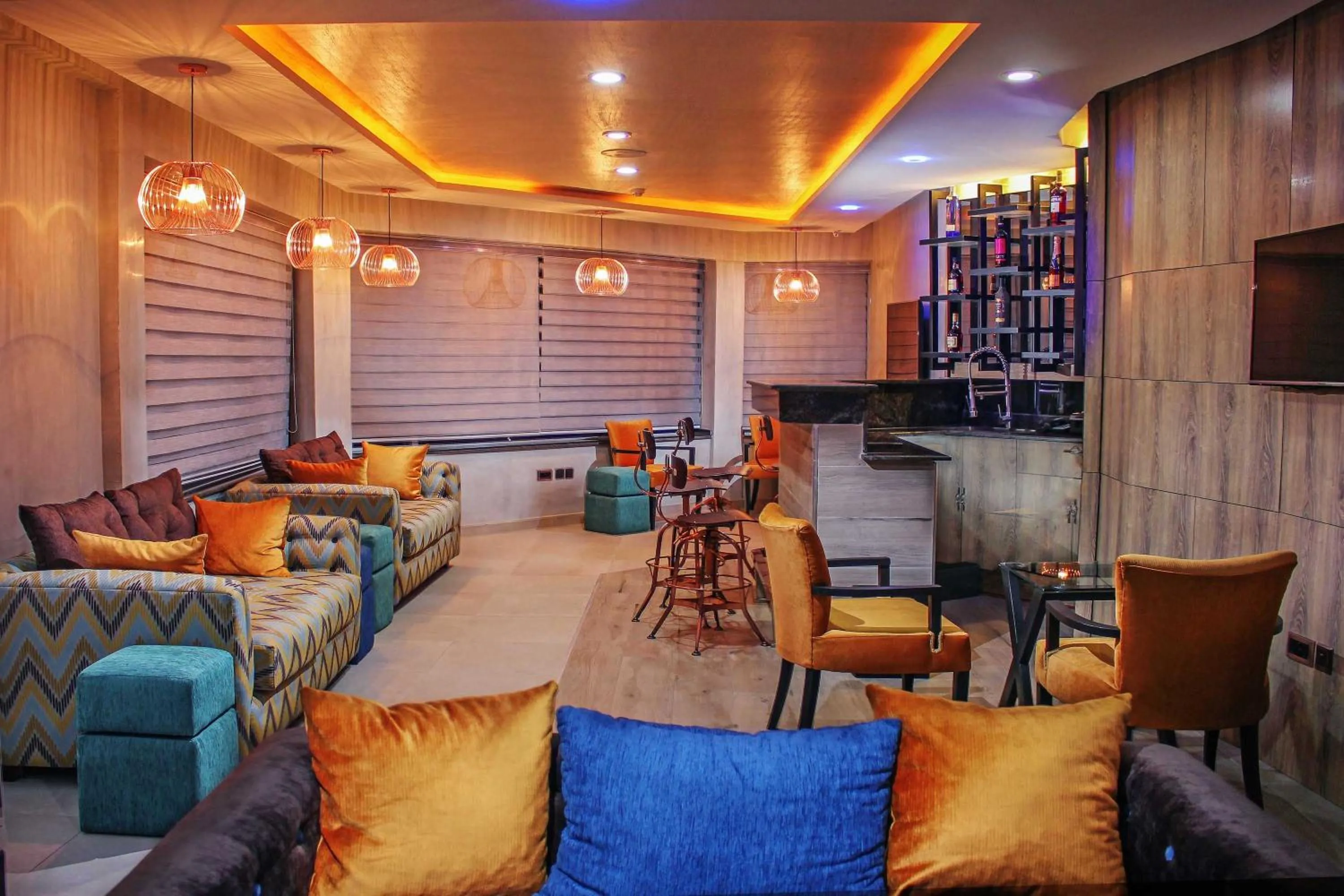 Communal lounge/ TV room in Joshesther Olive Hotel