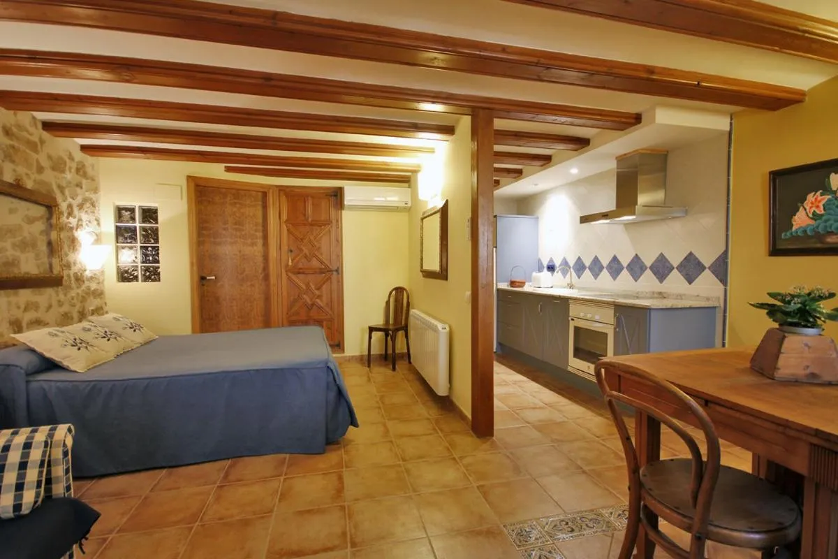 Kitchen or kitchenette, Bed in Apartamentos Santa Agueda