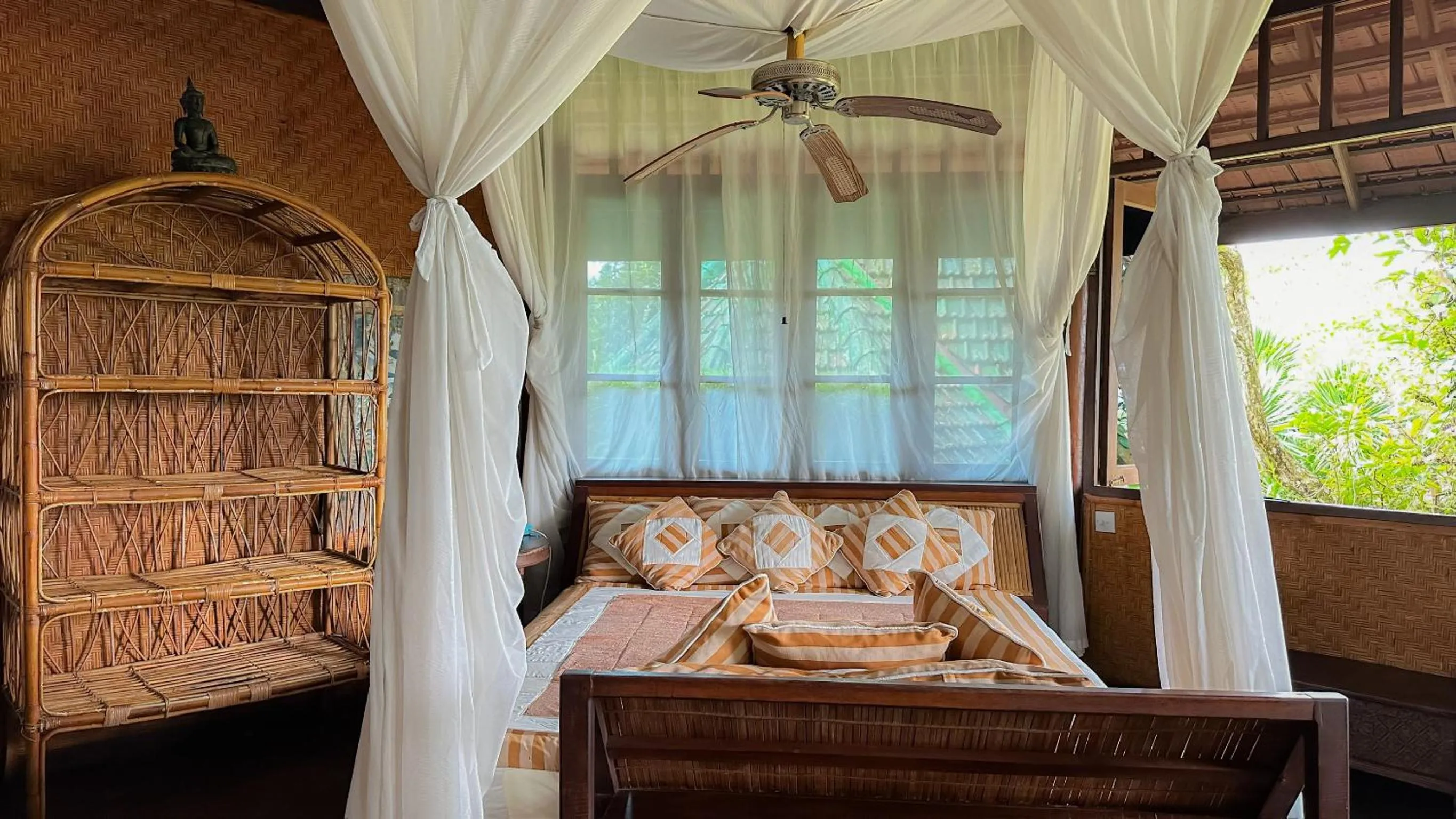 Bed in Tirtagangga Water Palace Villas