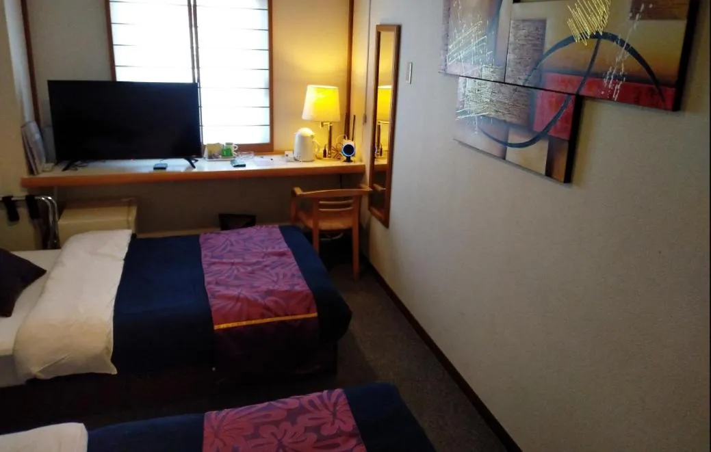 Bed in Hotel Yamachou