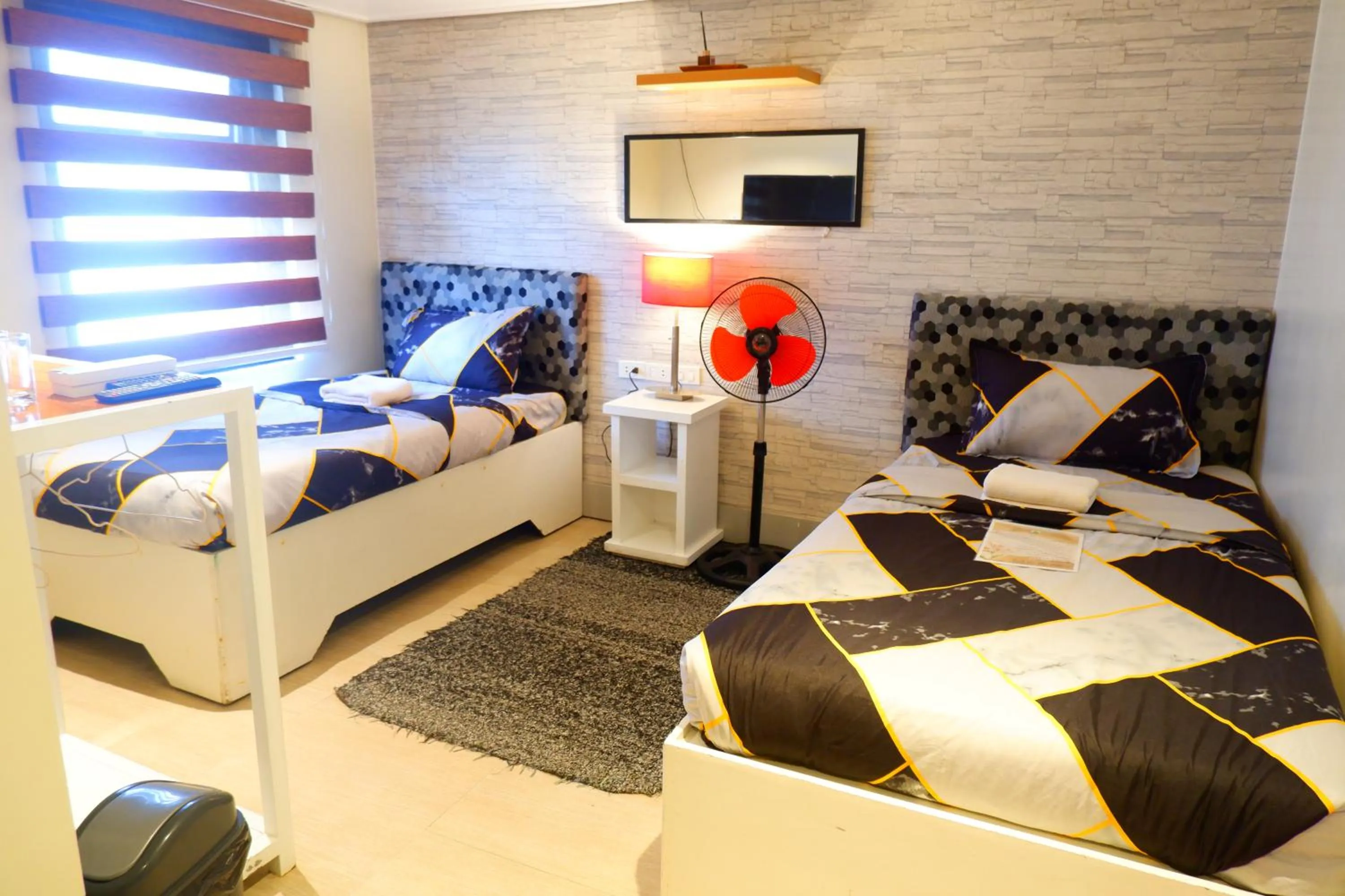 Bed in Sunset View Ridge Residences