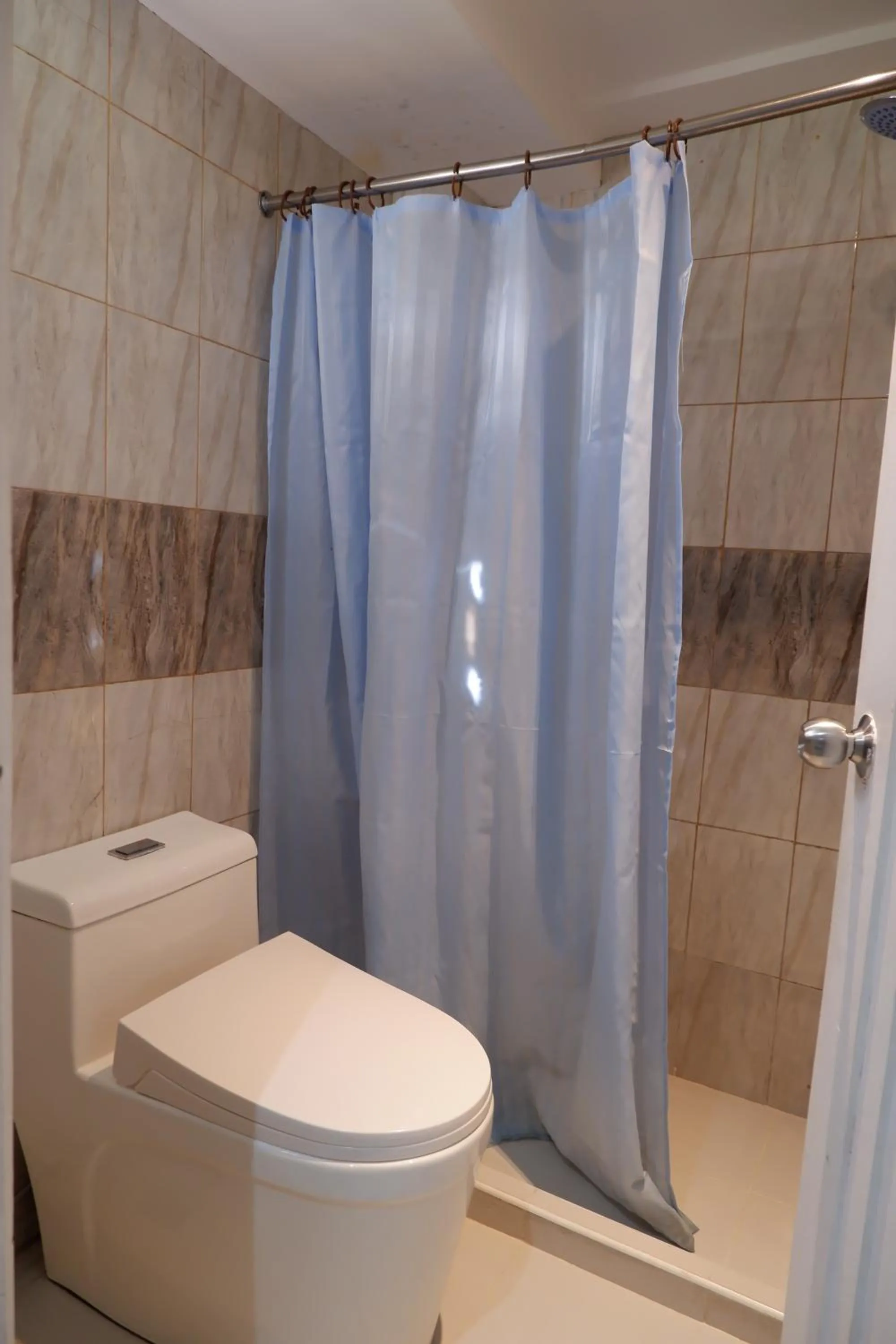 Shower in Sunset View Ridge Residences