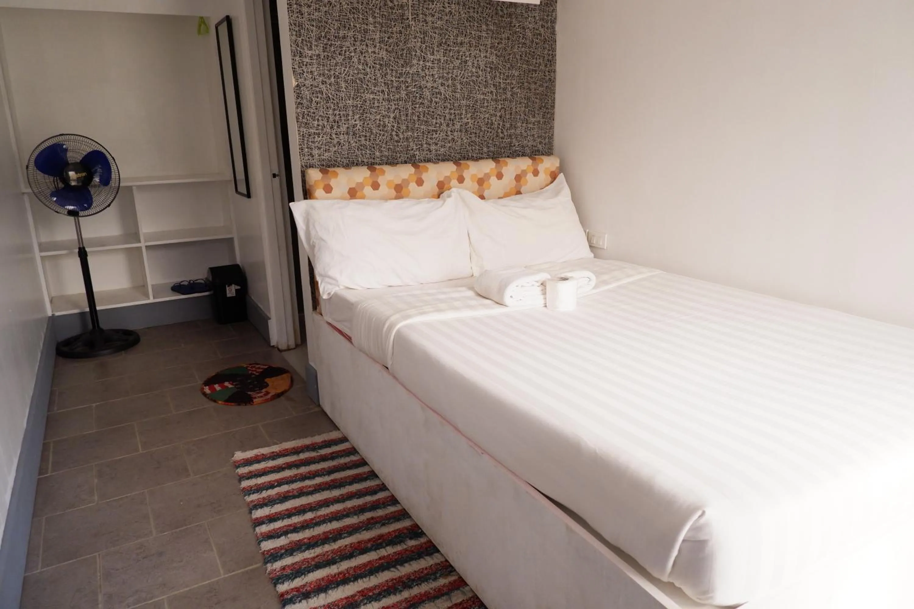 Bed in Sunset View Ridge Residences