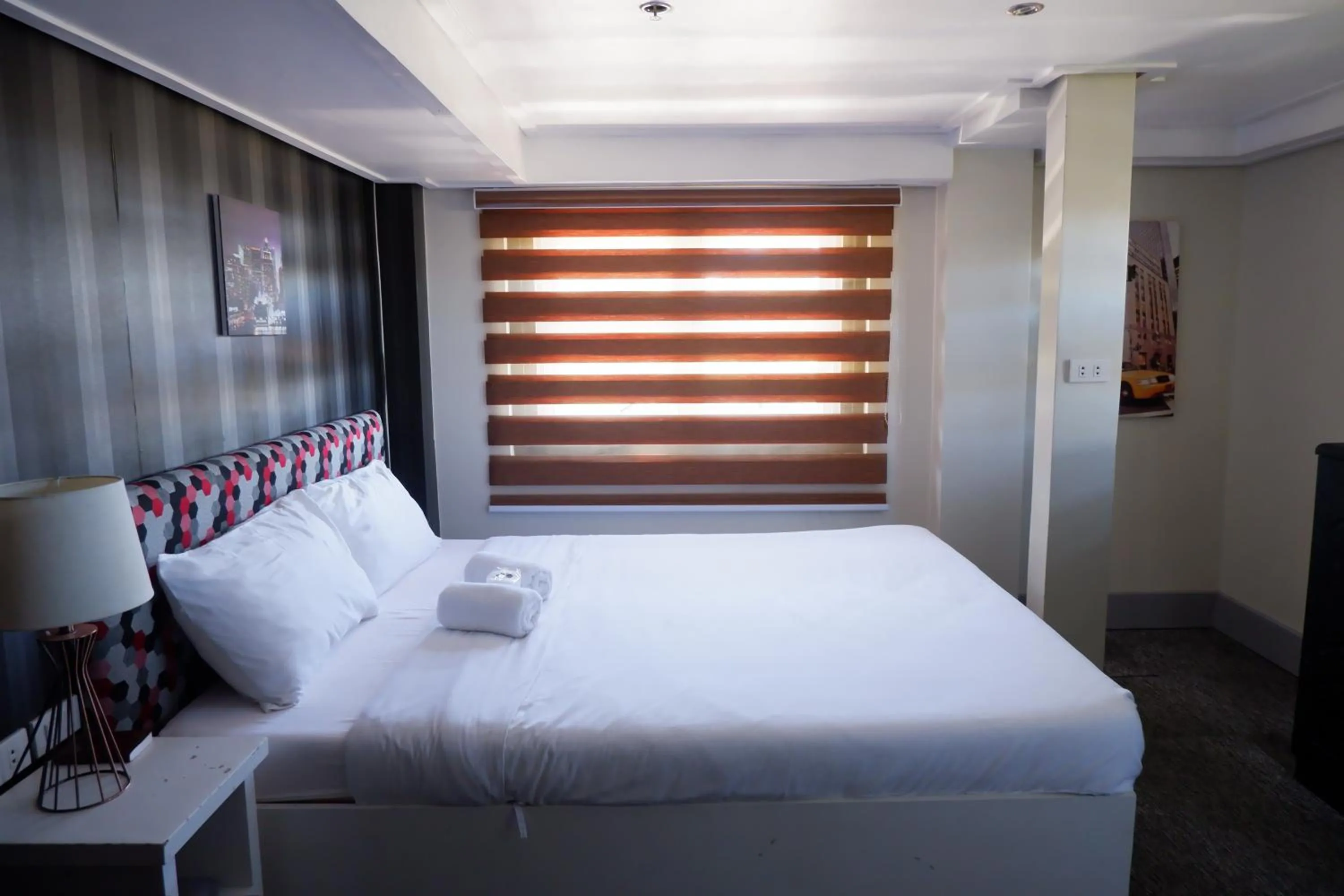 Bed in Sunset View Ridge Residences