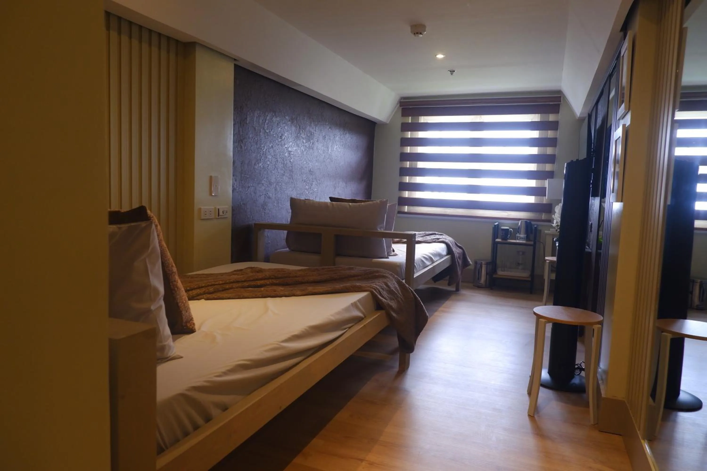 Bed in Sunset View Ridge Residences