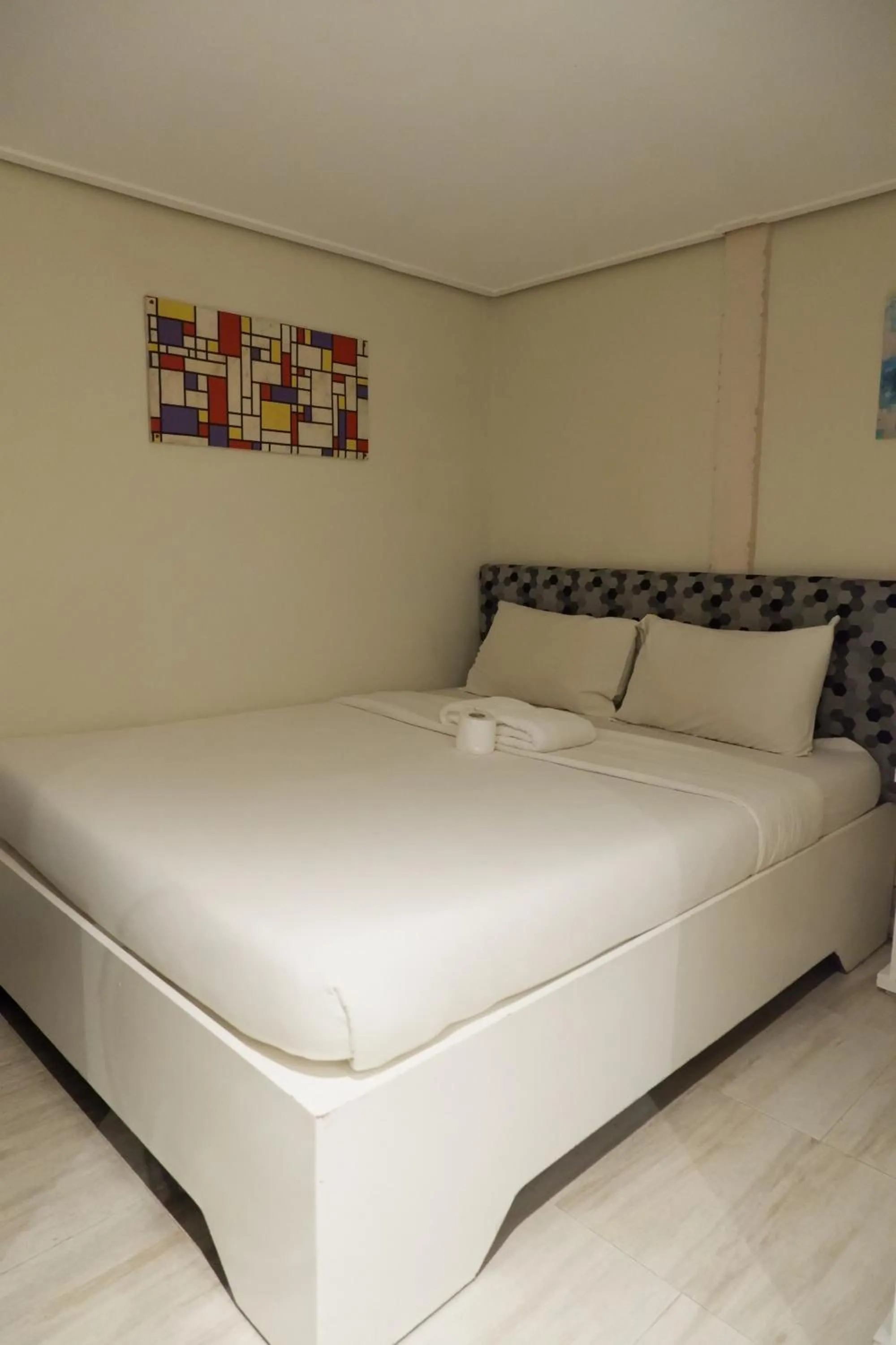 Bed in Sunset View Ridge Residences