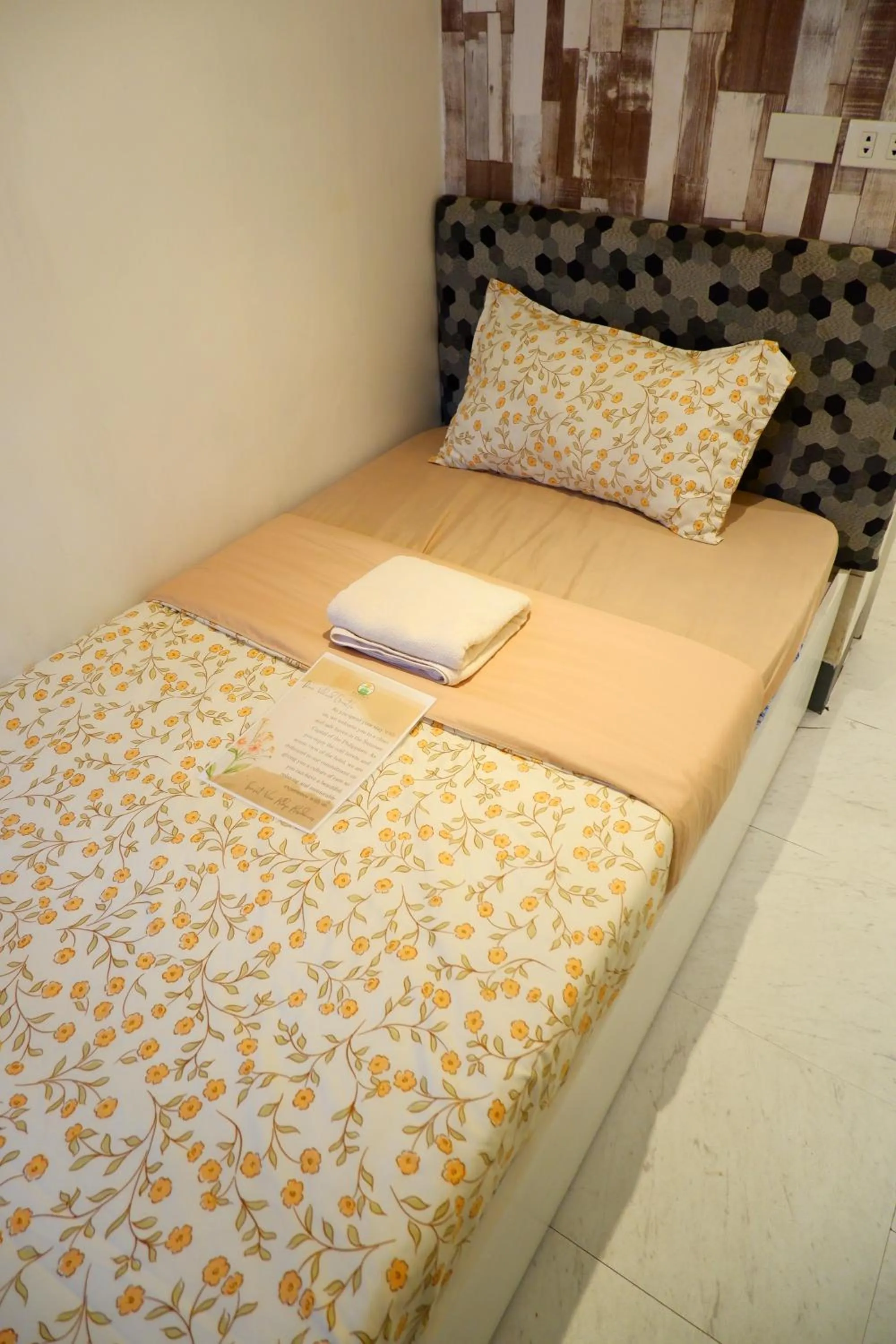 Bed in Sunset View Ridge Residences