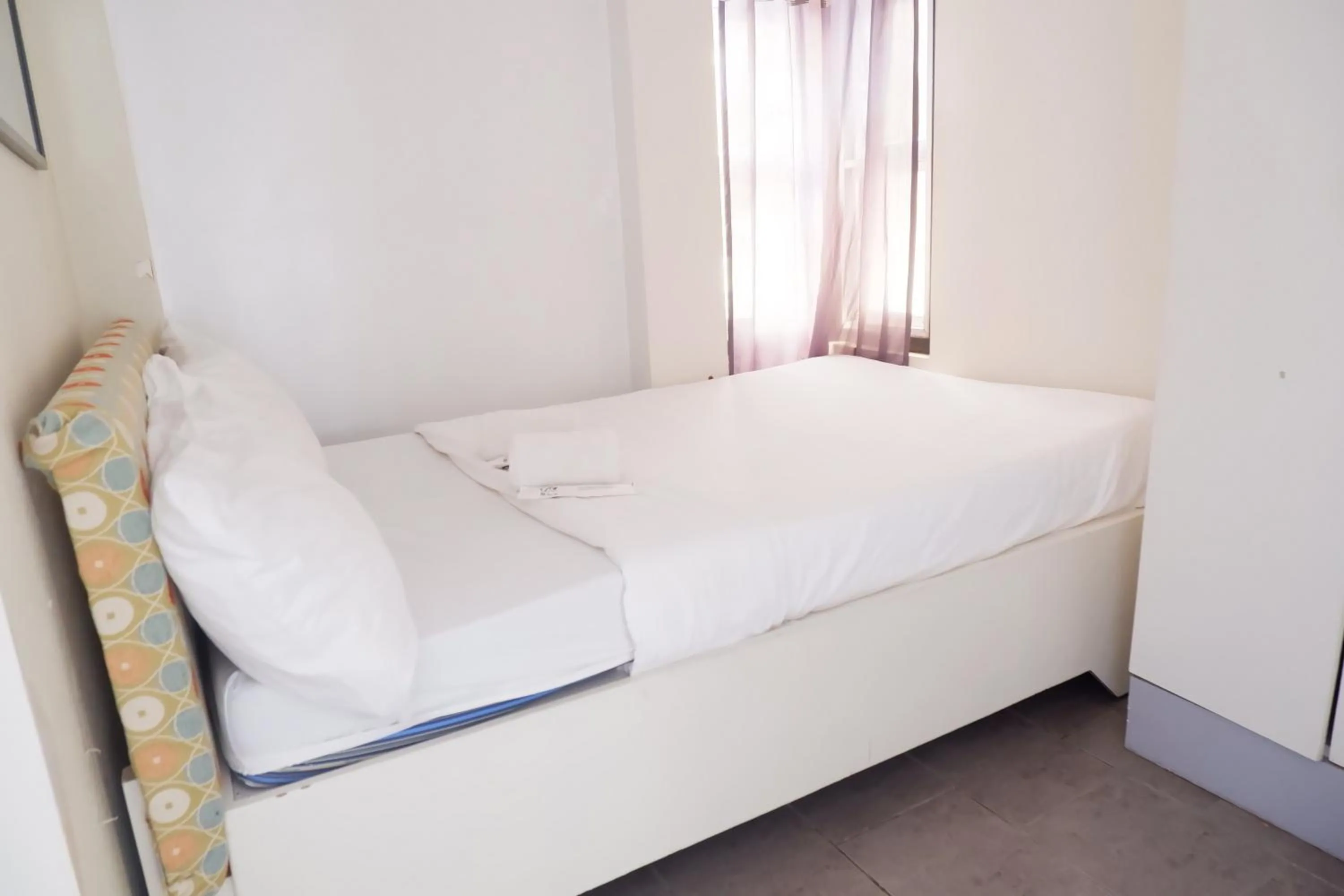 Bed in Sunset View Ridge Residences