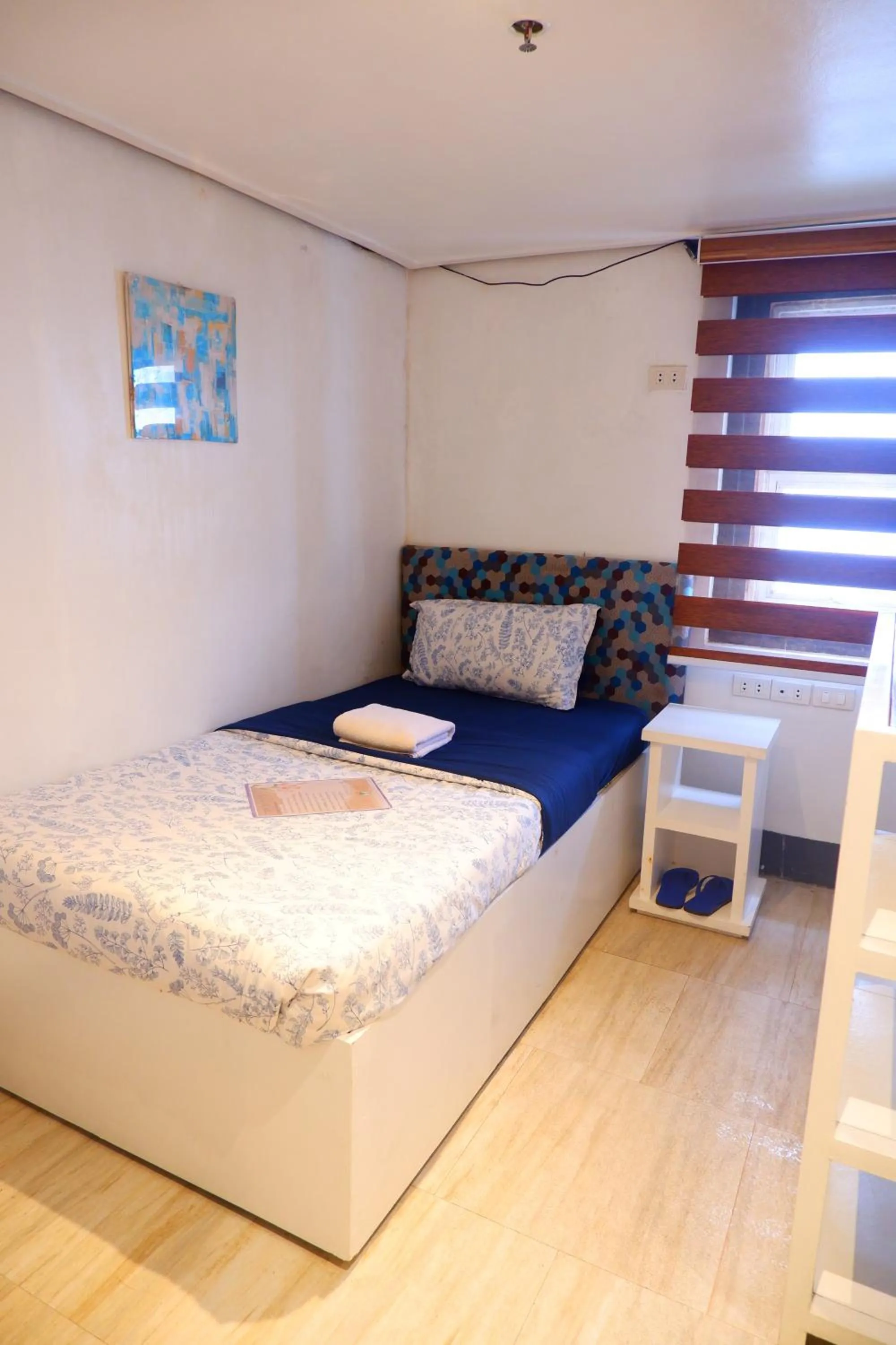 Bed in Sunset View Ridge Residences