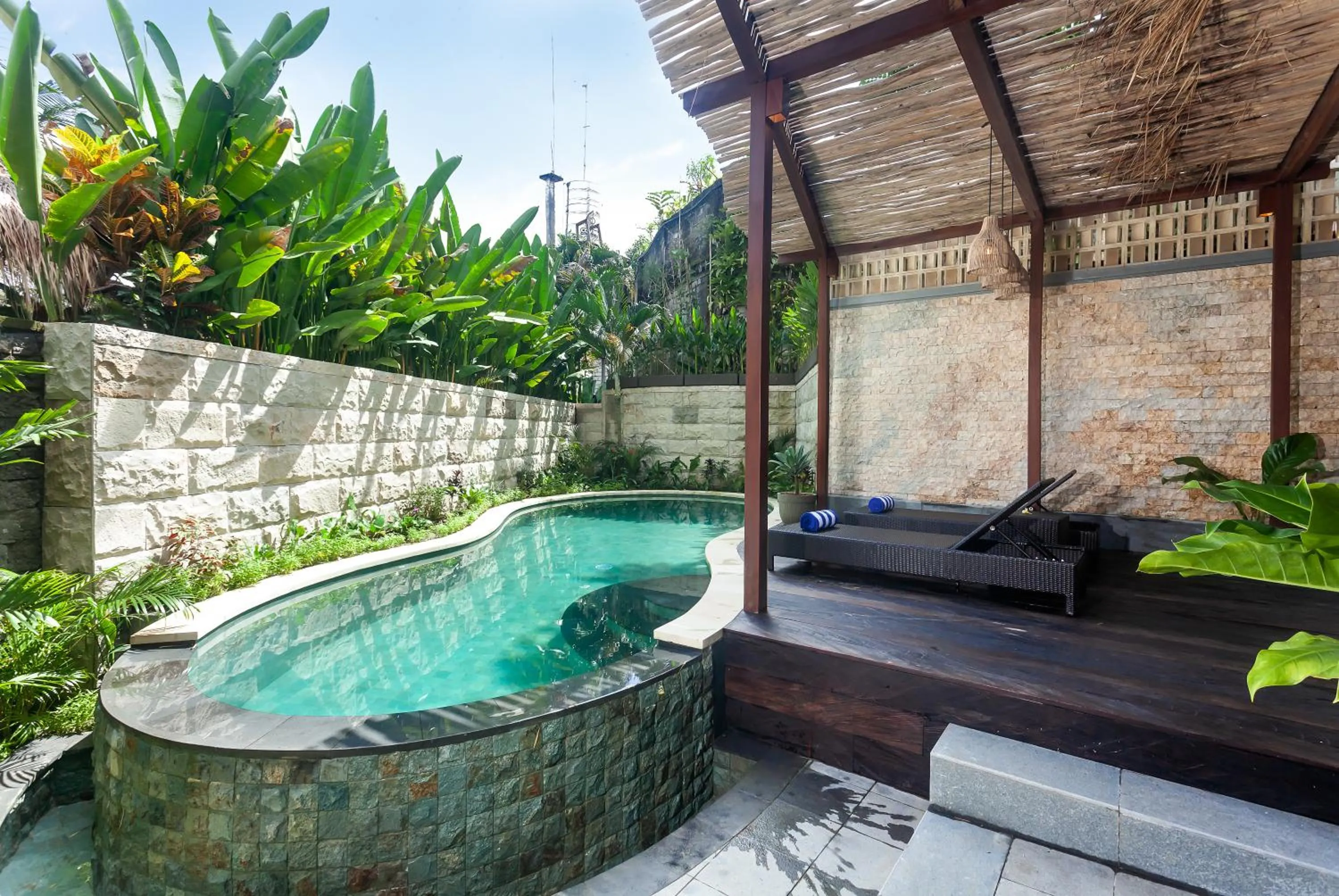 Swimming pool in Manah Shanti Suites by GenuineHost