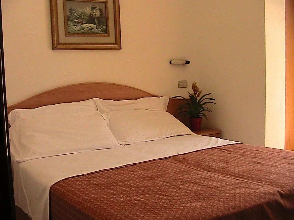 Bed in Hotel Universo