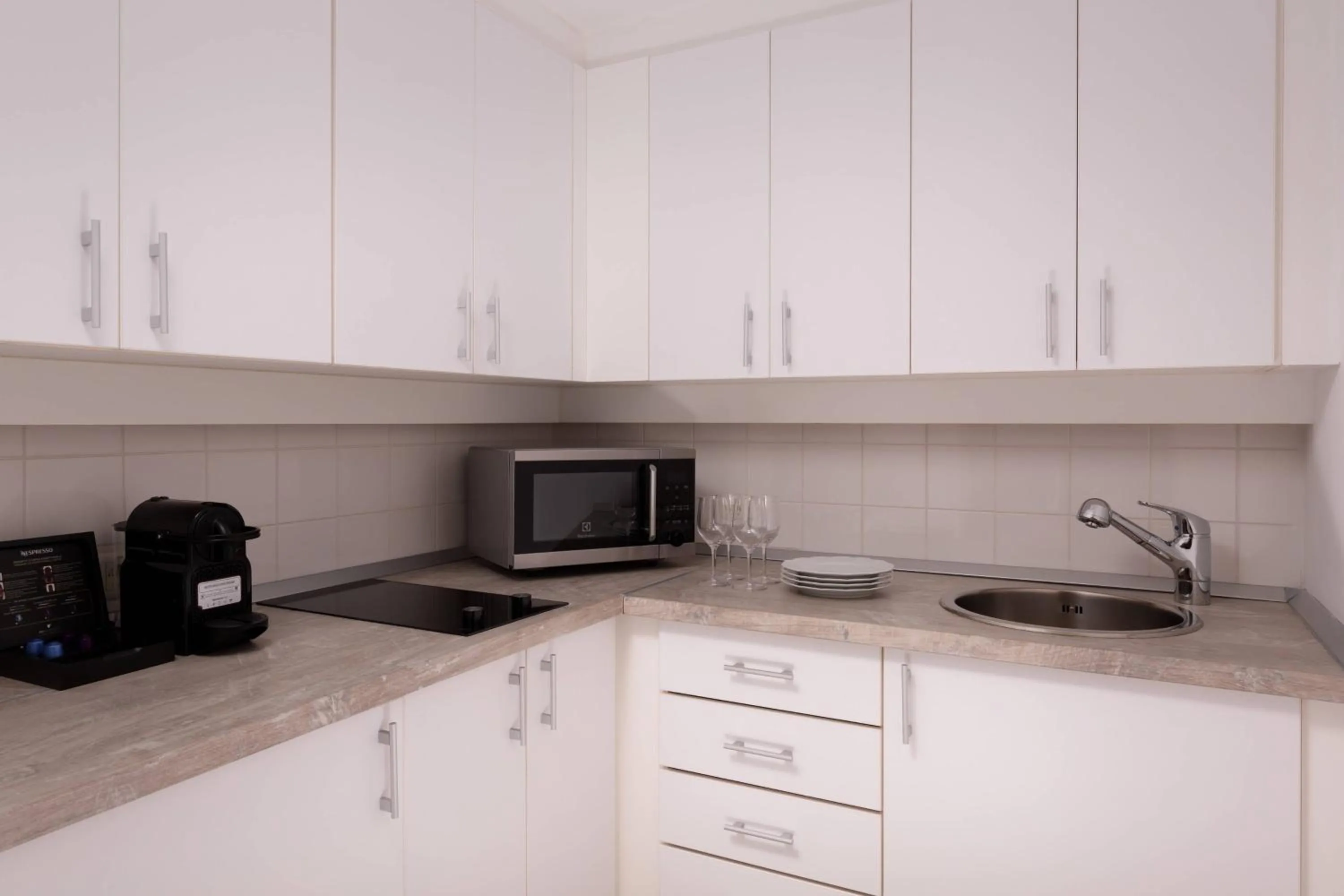 Kitchen or kitchenette in JW Marriott Bucharest Grand Hotel