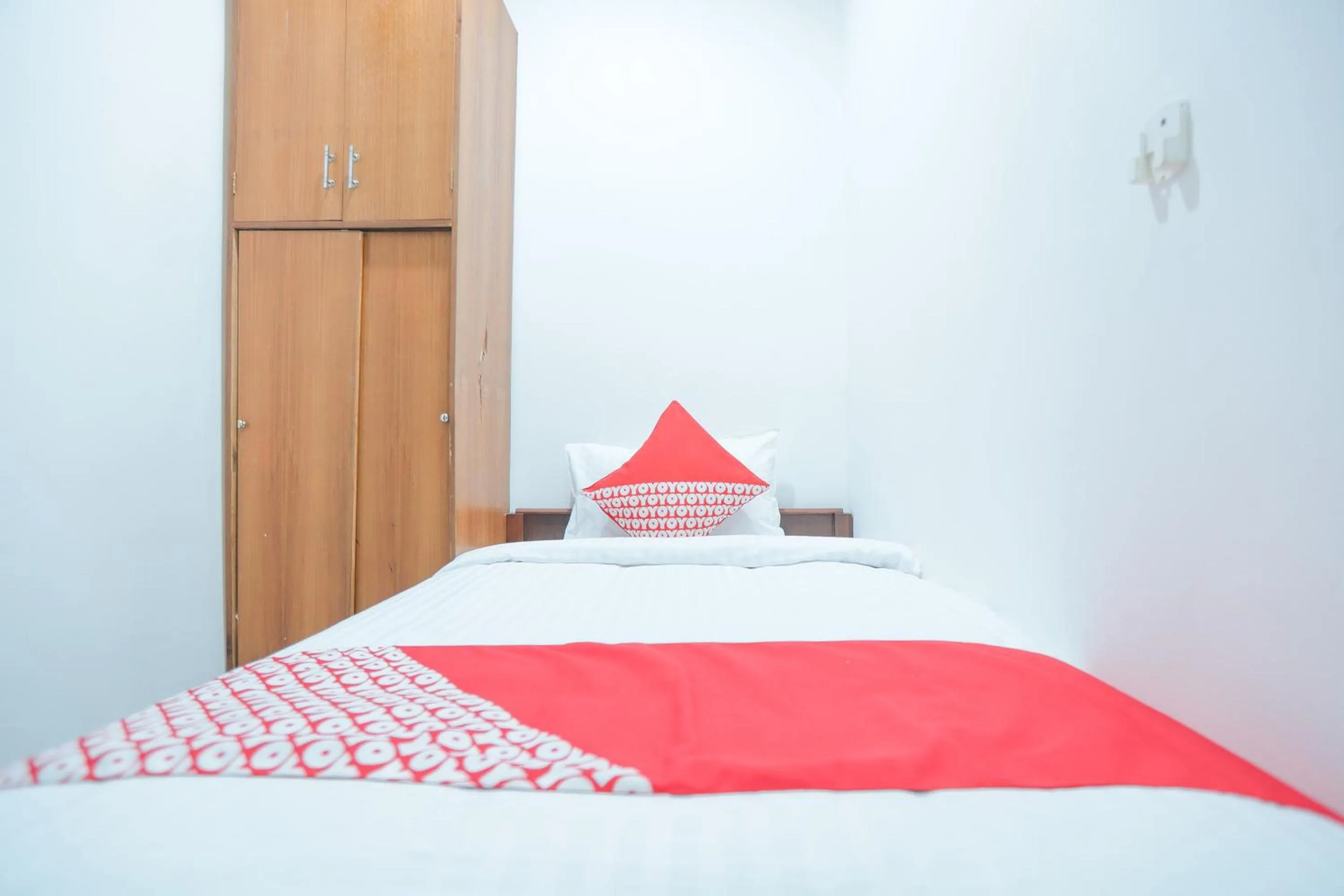 Bedroom in OYO 150 Harmoni Residence