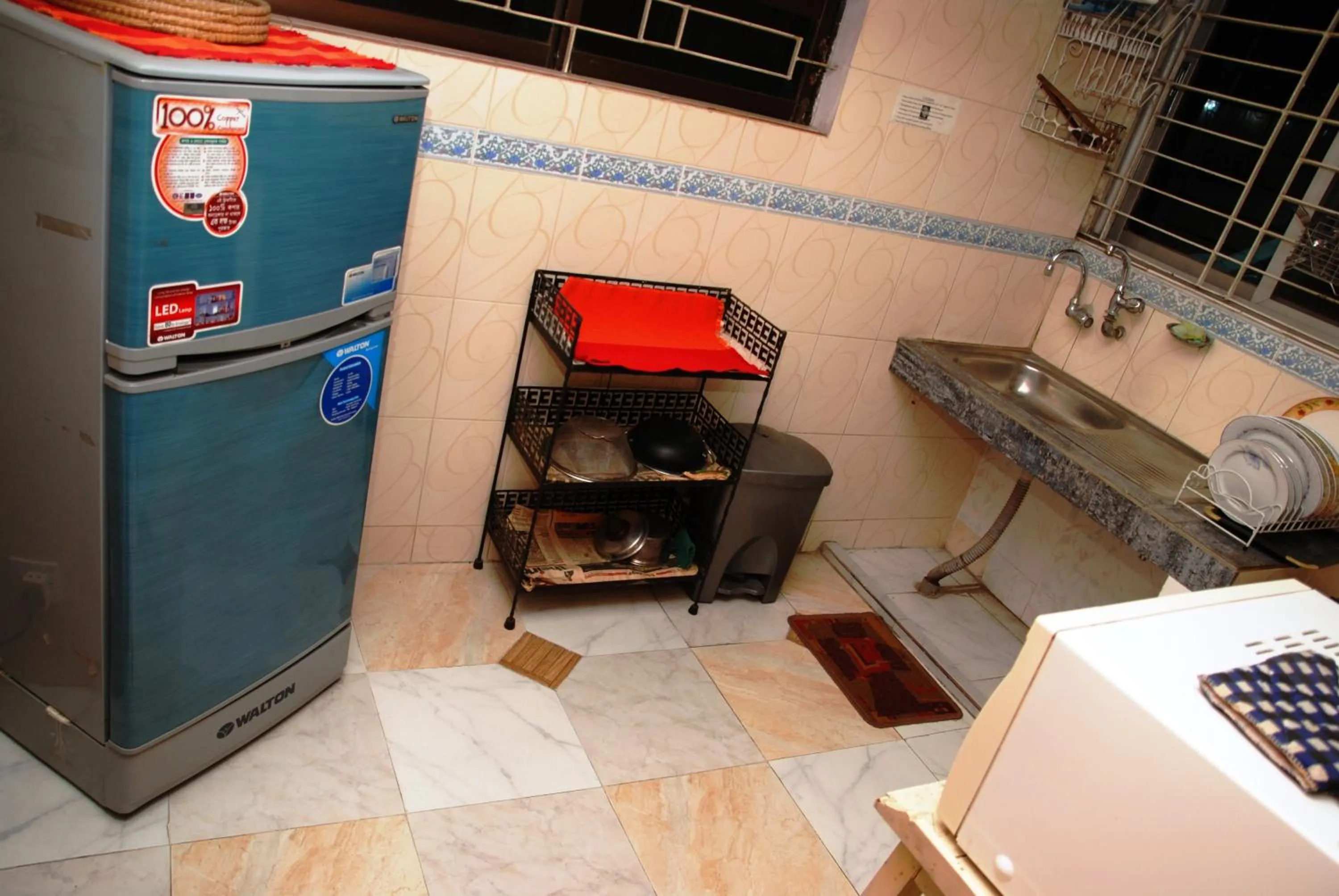 Kitchen or kitchenette in Babylon Hotel & Serviced Apartment