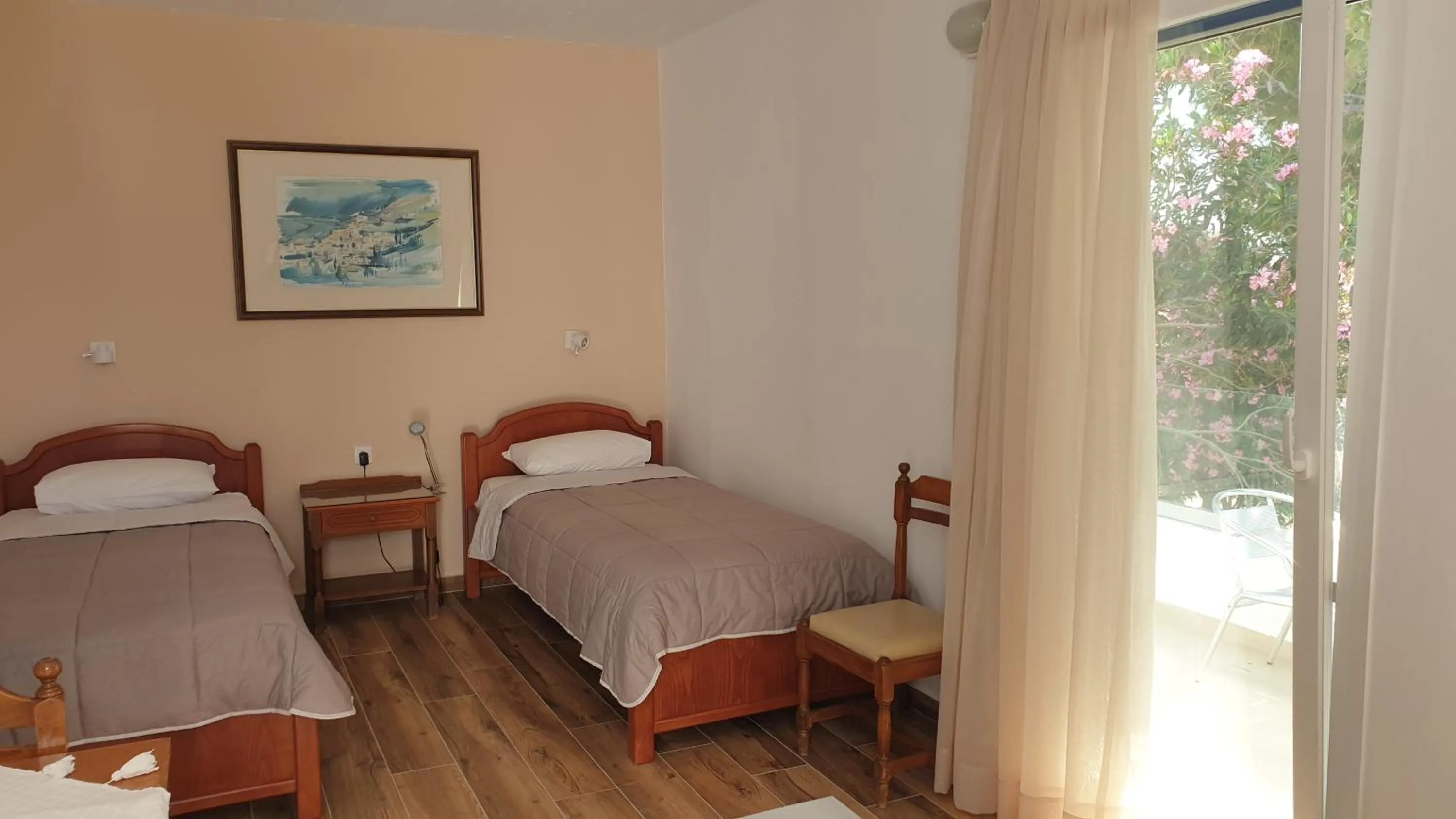 Bed in Miros Hotel Apartments