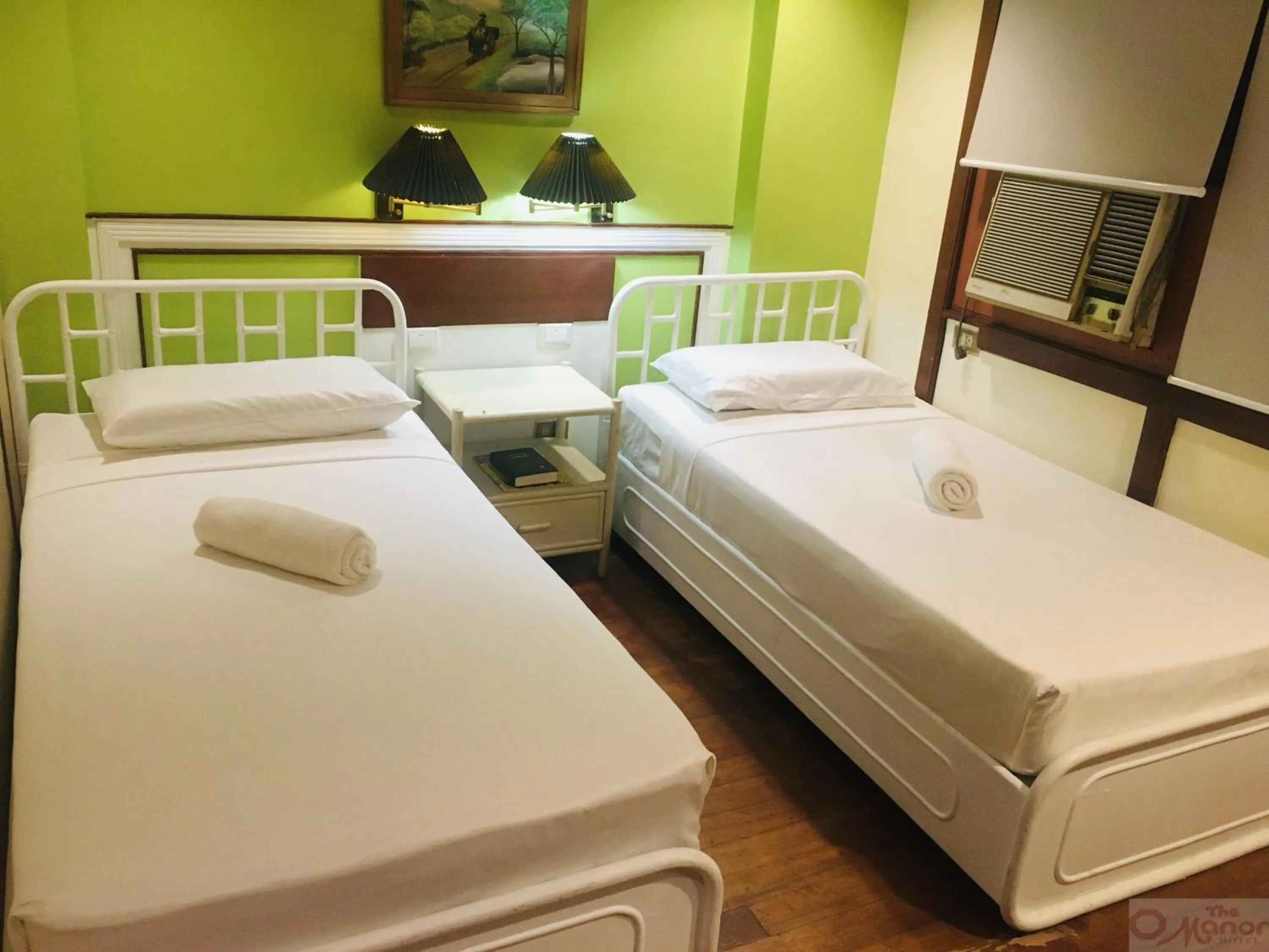 Bed in The Manor Hotel