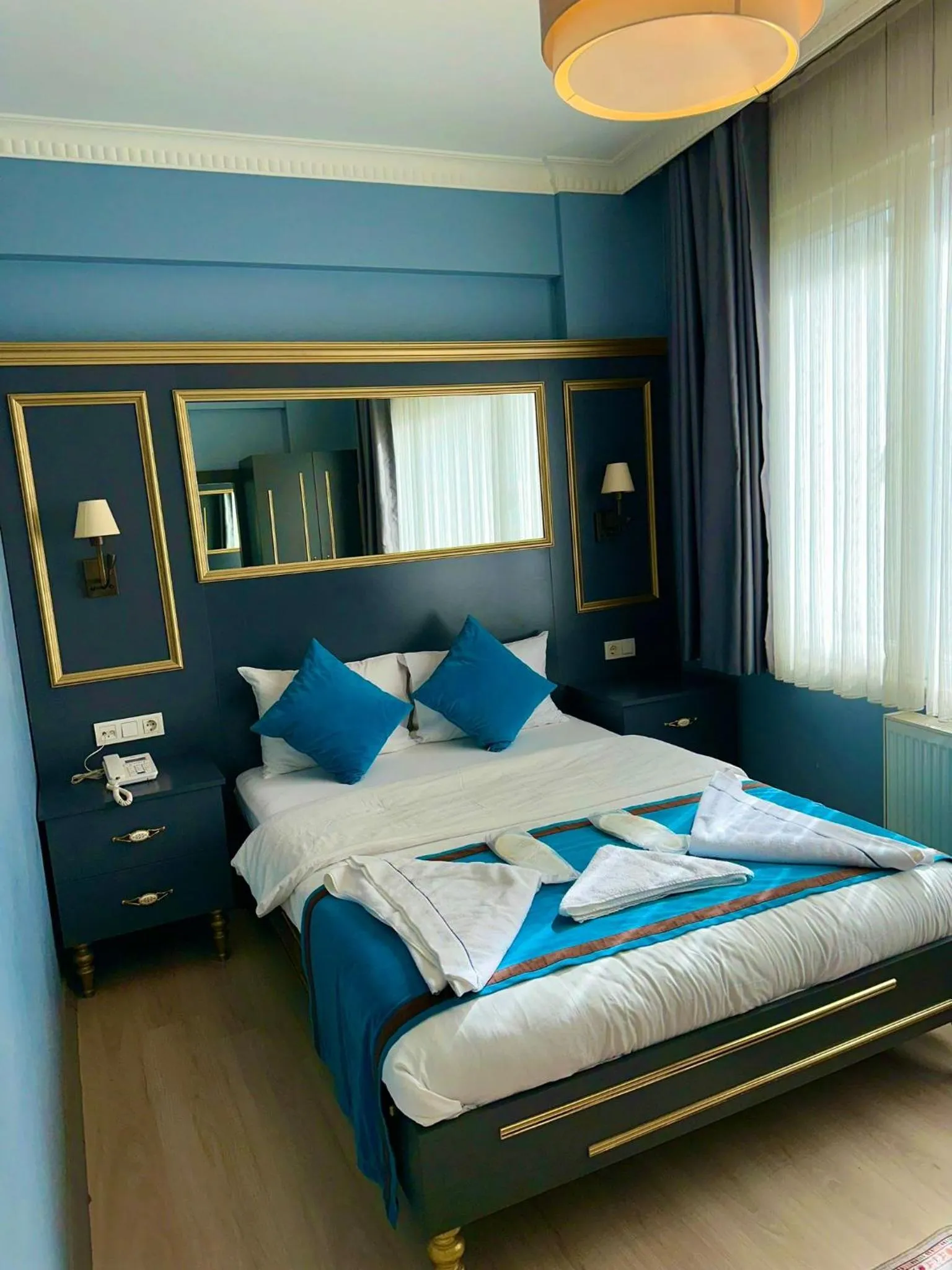 Bed in Grand Moon Hotel Suites