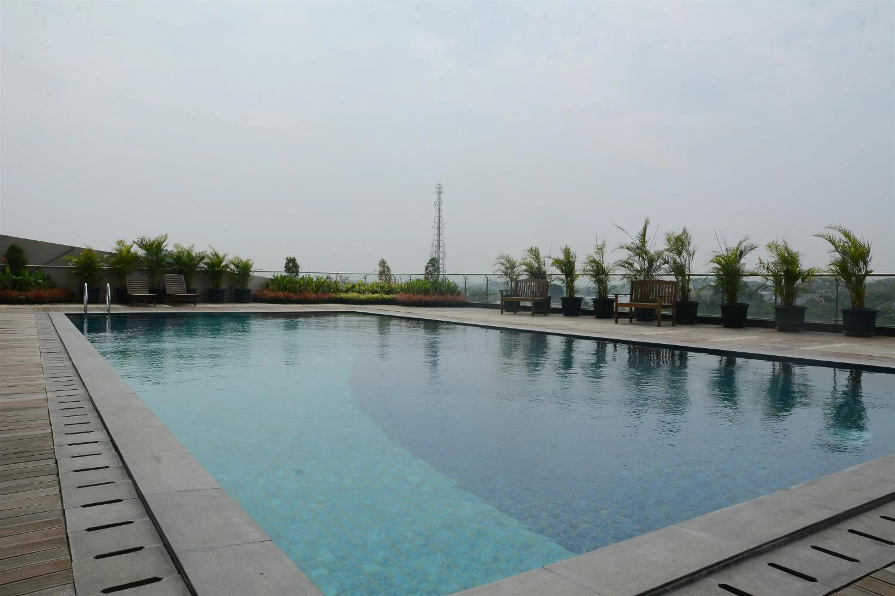 Swimming pool in Brand New Studio Tree Park City BSD Apartment near ICE BSD By Travelio