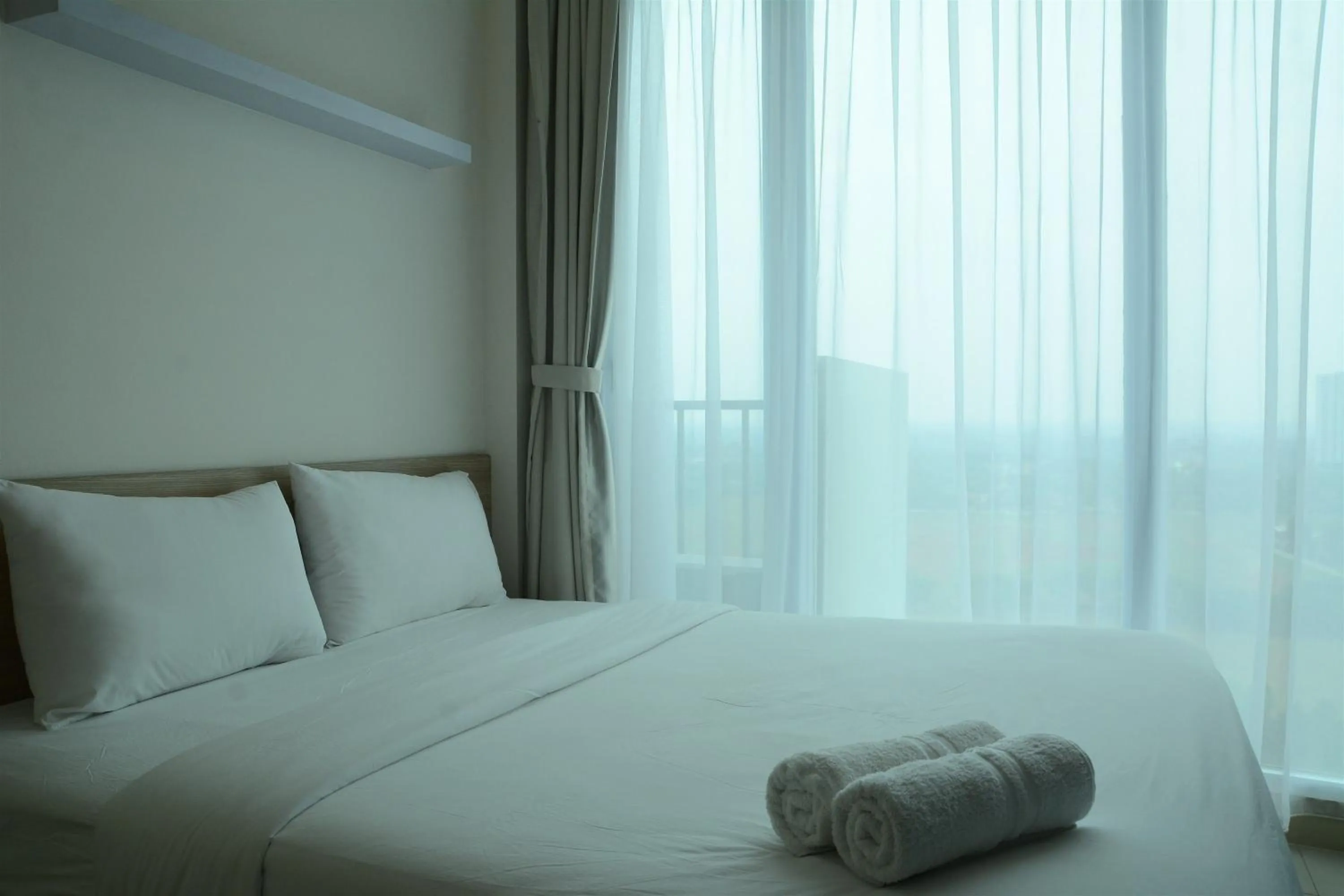 Bed in Brand New Studio Tree Park City BSD Apartment near ICE BSD By Travelio