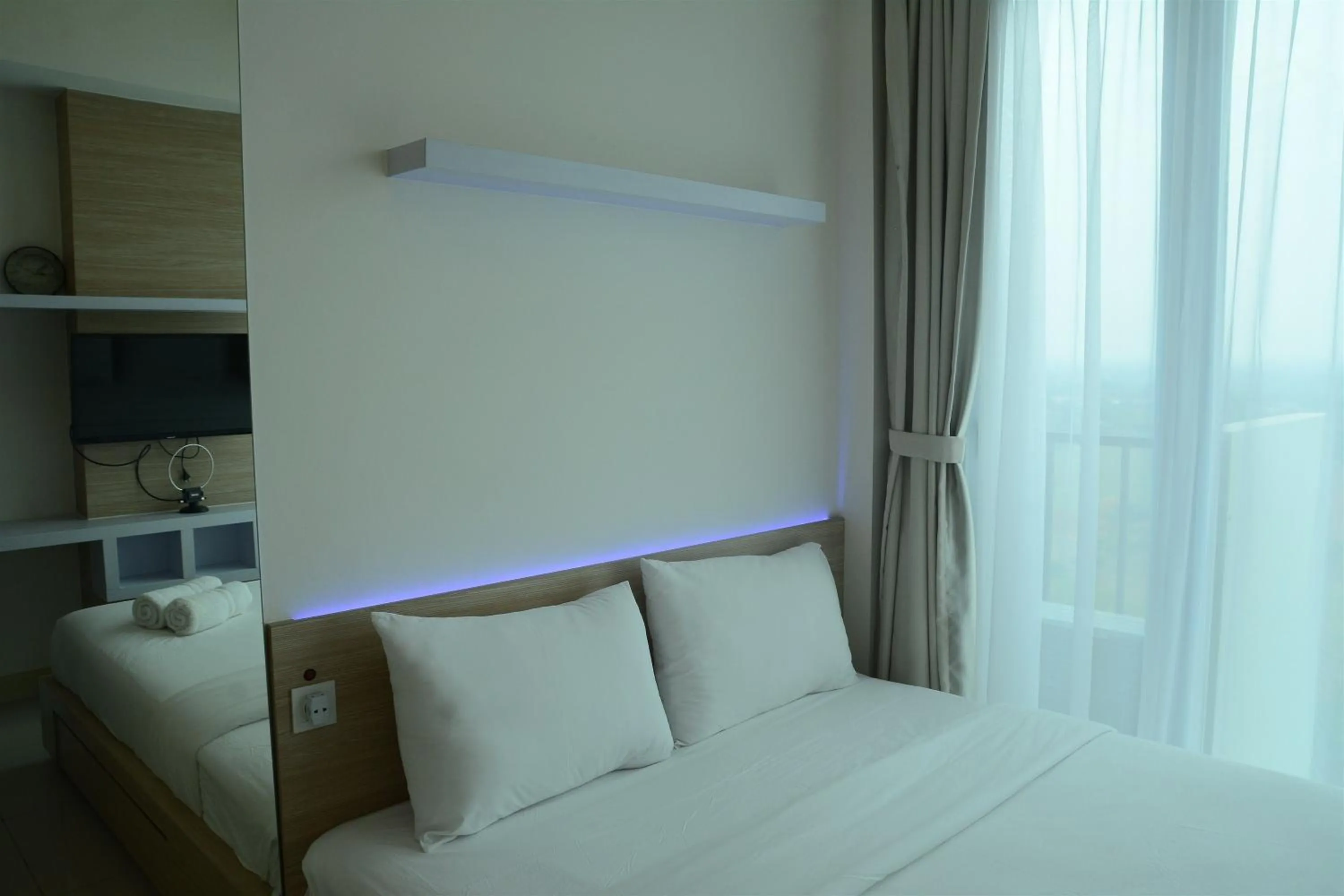 Bed in Brand New Studio Tree Park City BSD Apartment near ICE BSD By Travelio