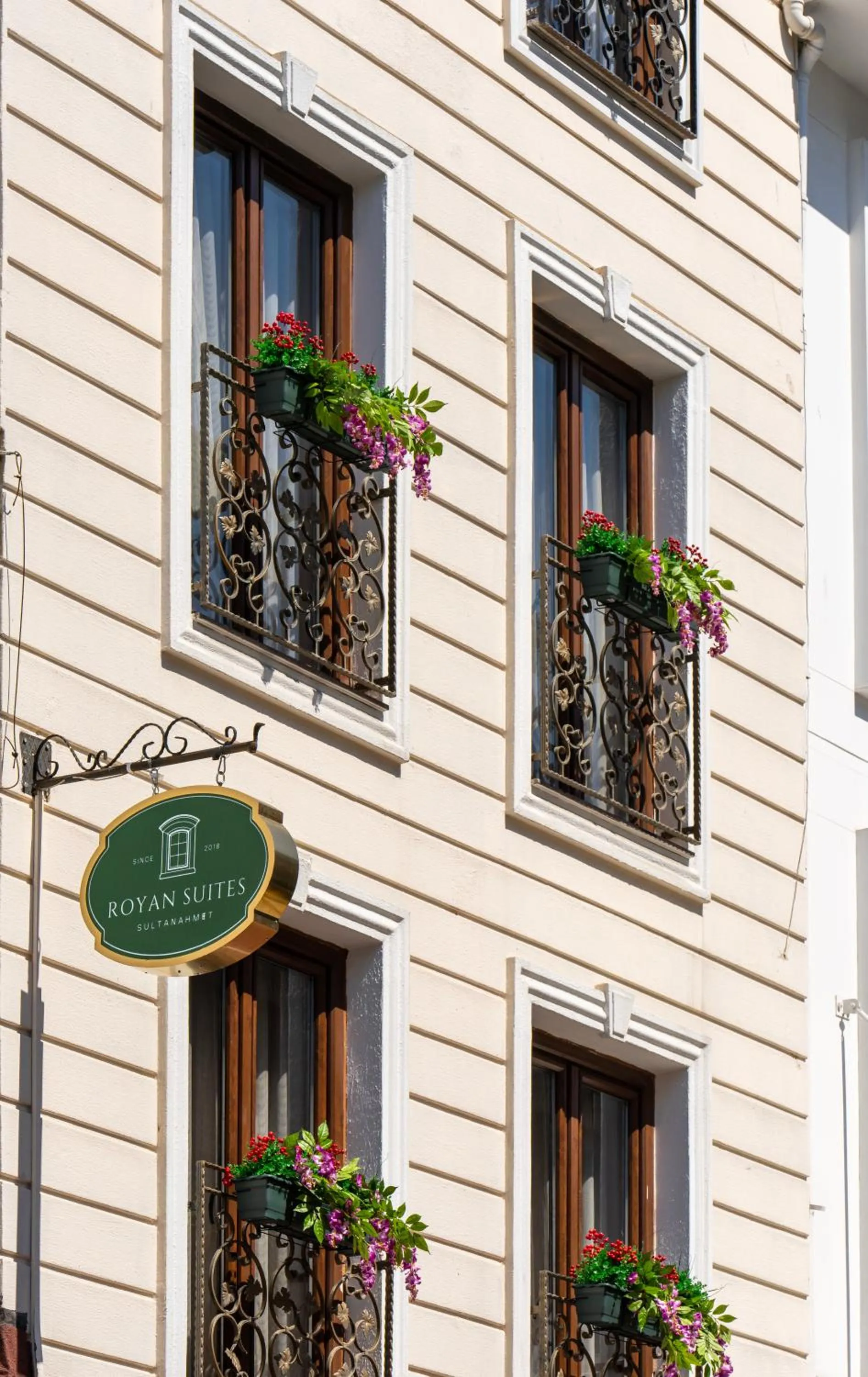 Property logo or sign in Royan Suites