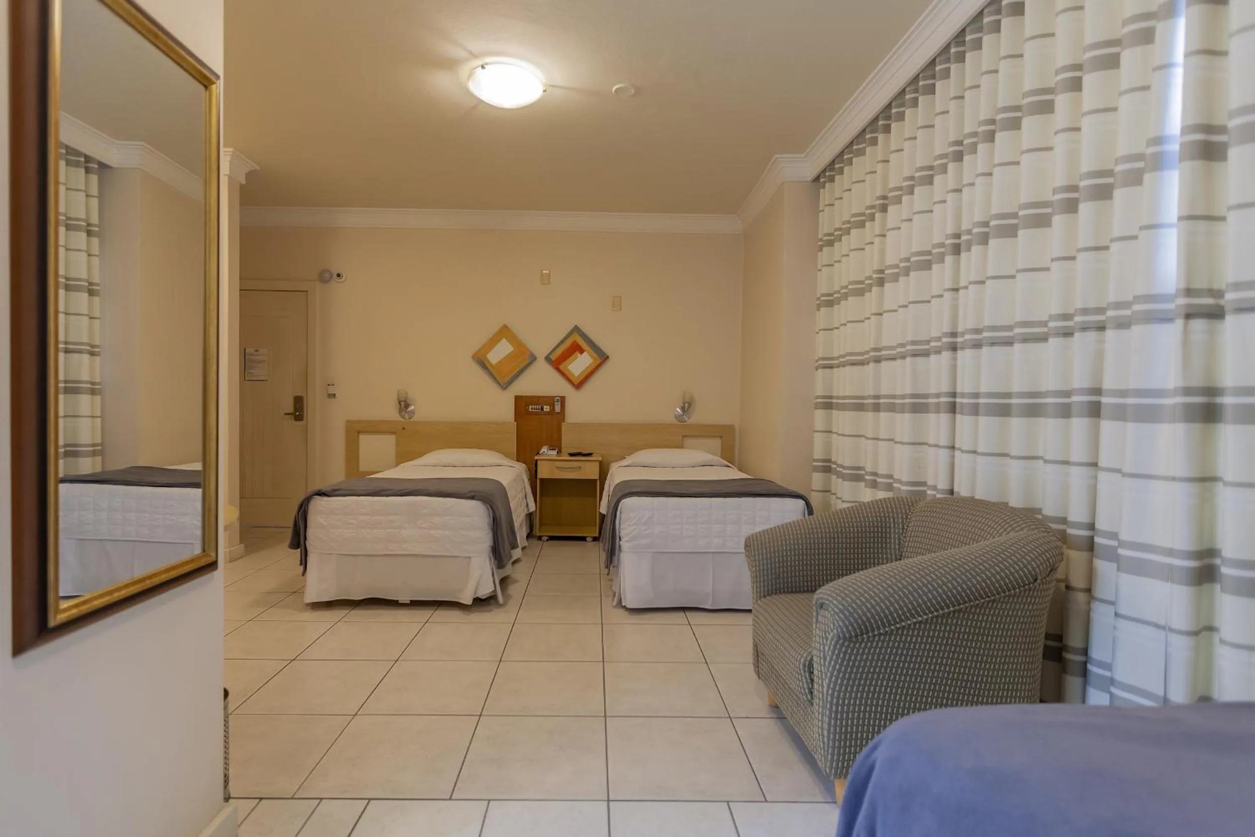 Bedroom, Bed in Tri Hotel Executive Criciúma