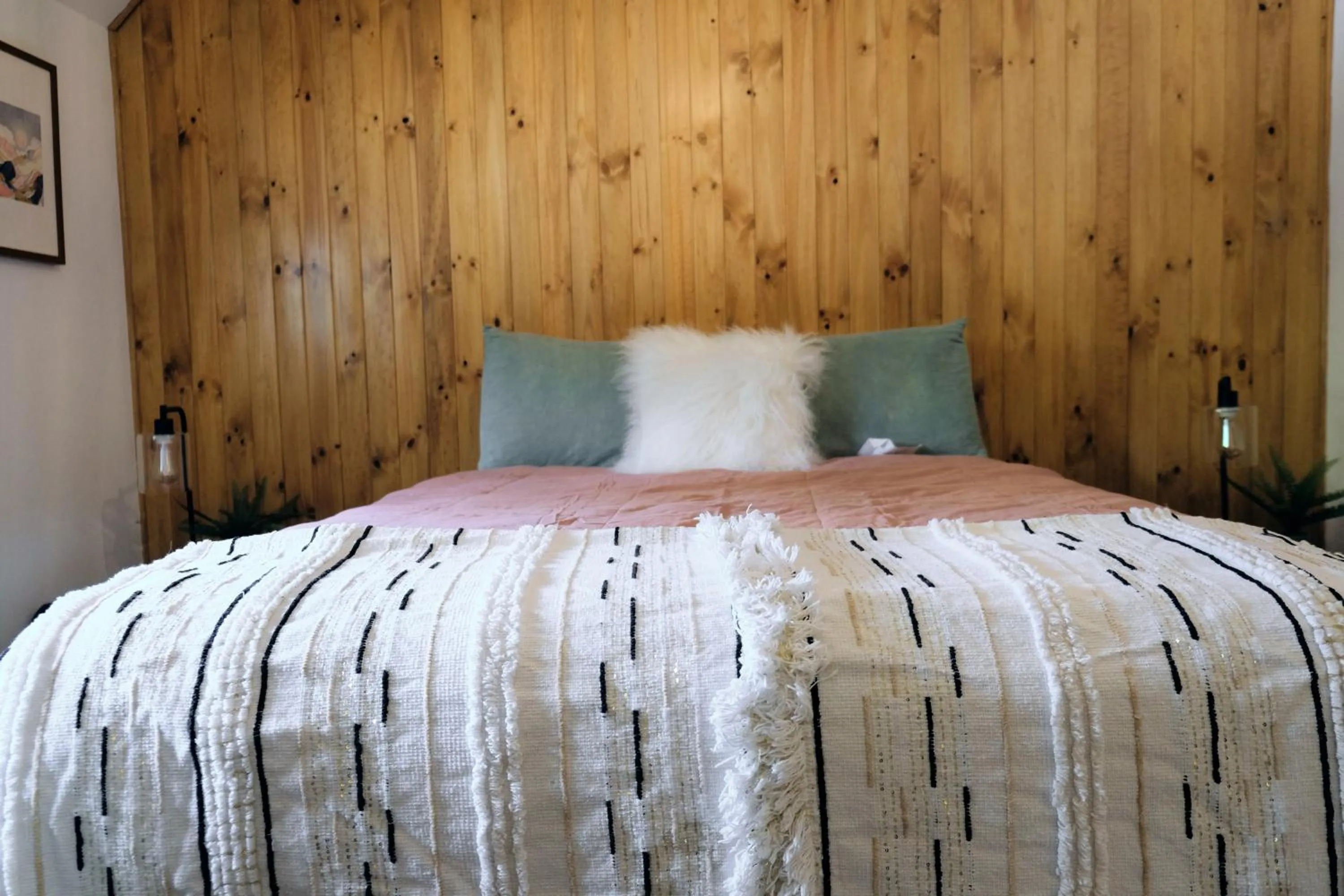 Bed in Lake Front Cabins