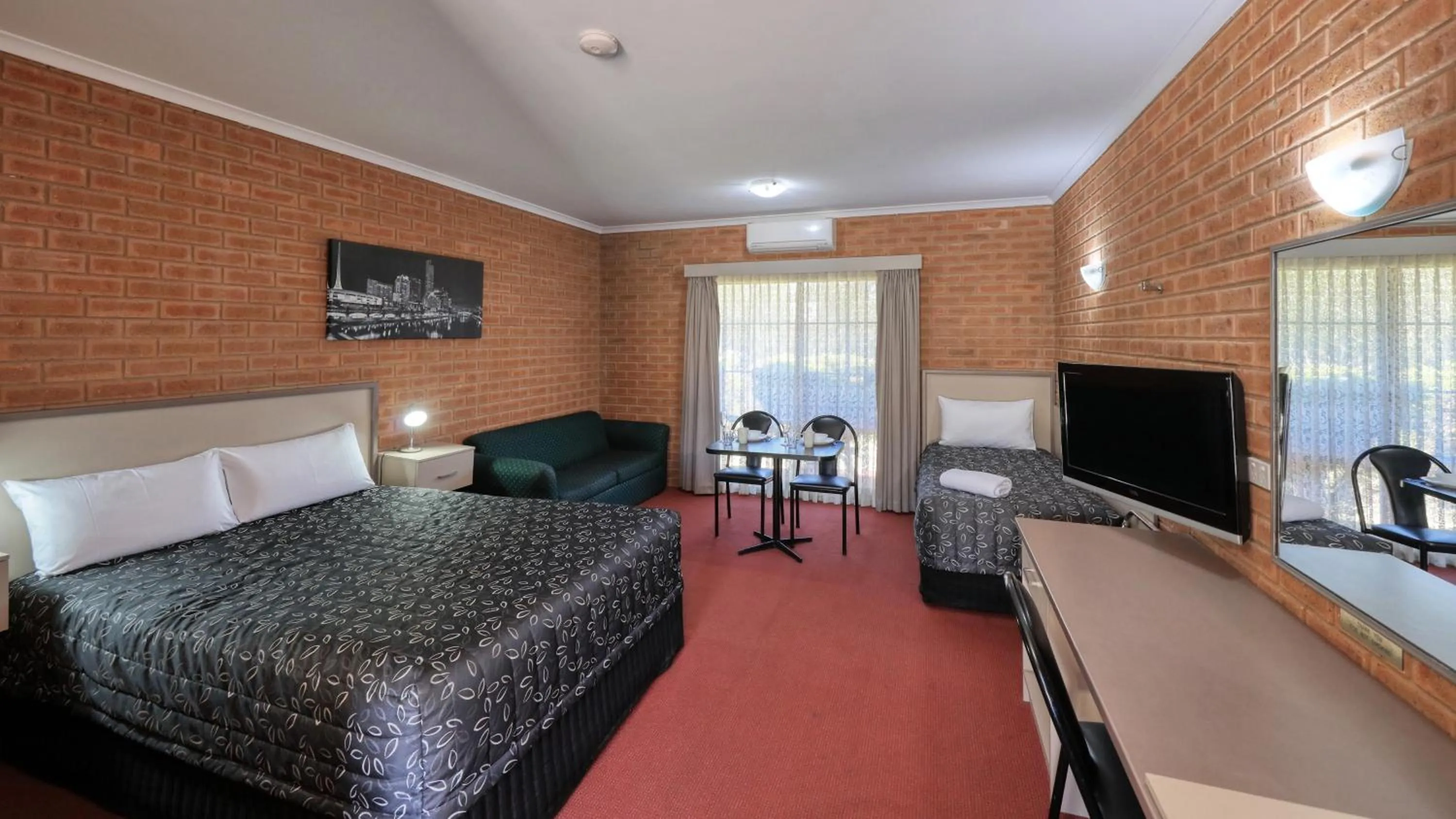 Bed in Glider City Motel Benalla
