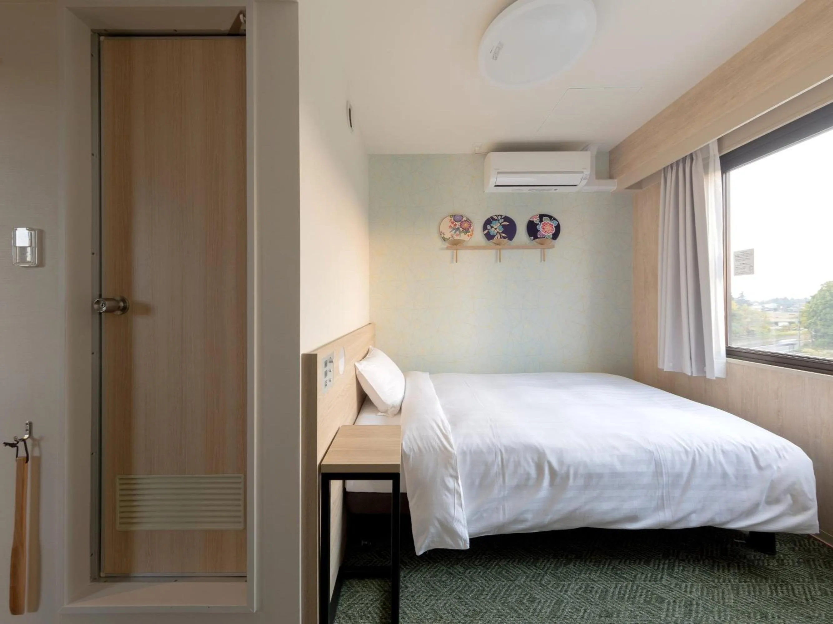 Bed in SkyHeart Hotel Narita