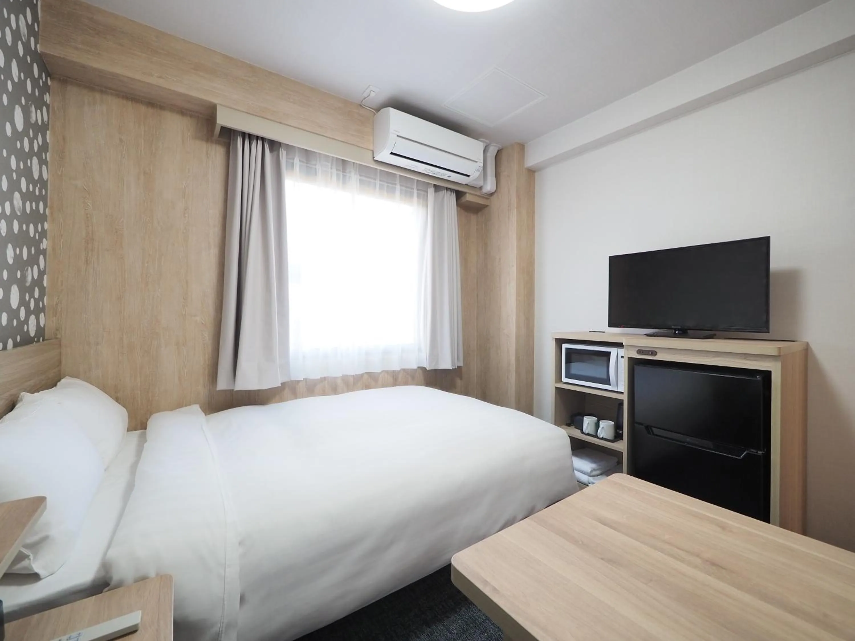 Bed in SkyHeart Hotel Narita